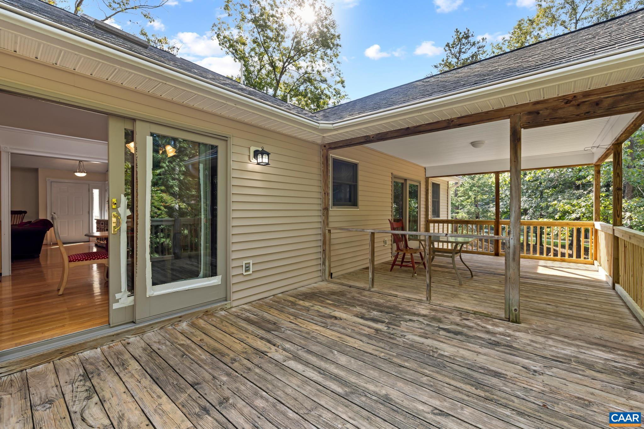 This back deck with a covered area seamlessly extends your living space outdoors. Perfect for relaxing, dining, entertaining and enjoying the outdoors in comfort.