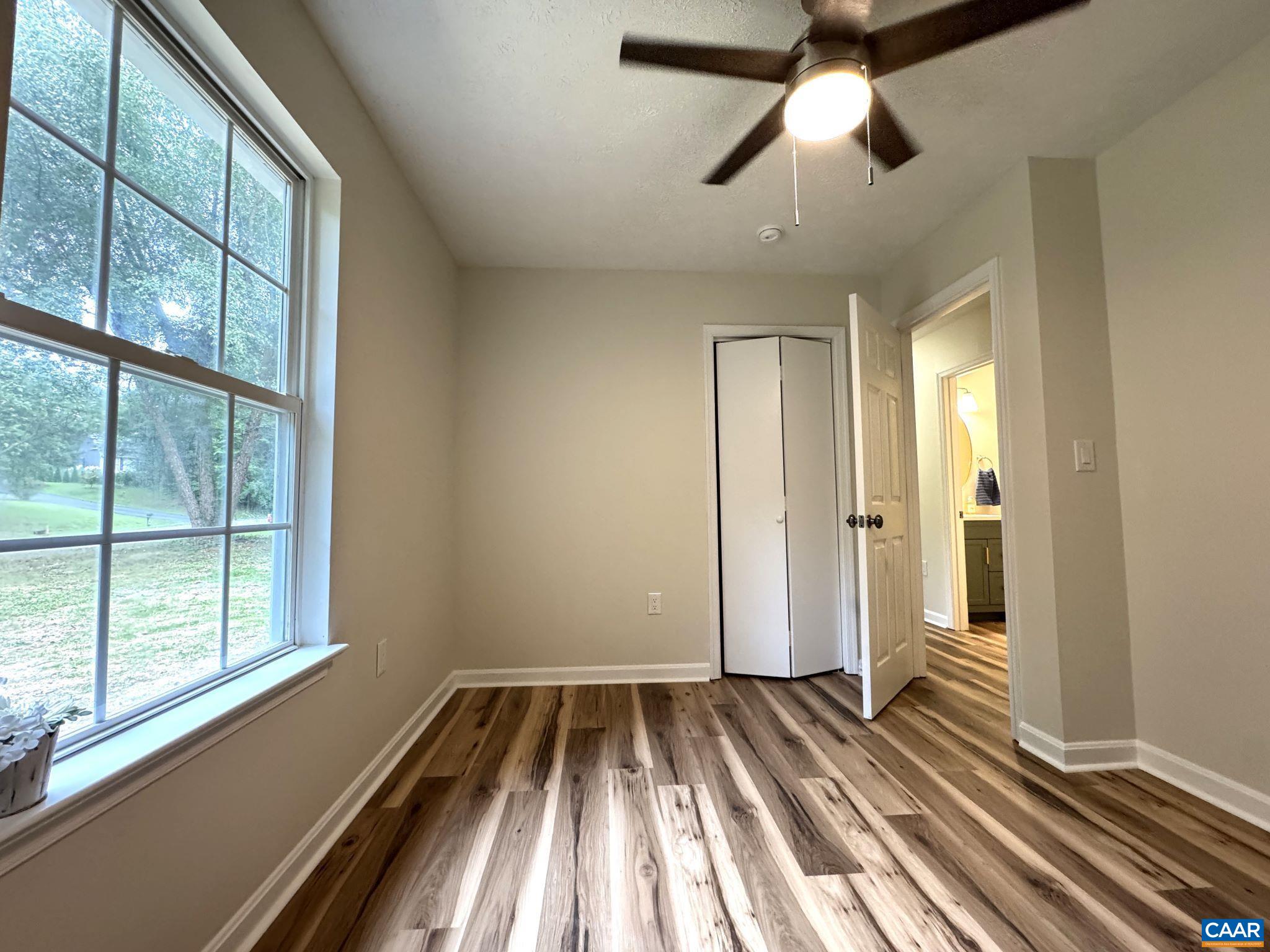 Bedroom 2 of 3 - Custom Ceiling Fan, LVP flooring