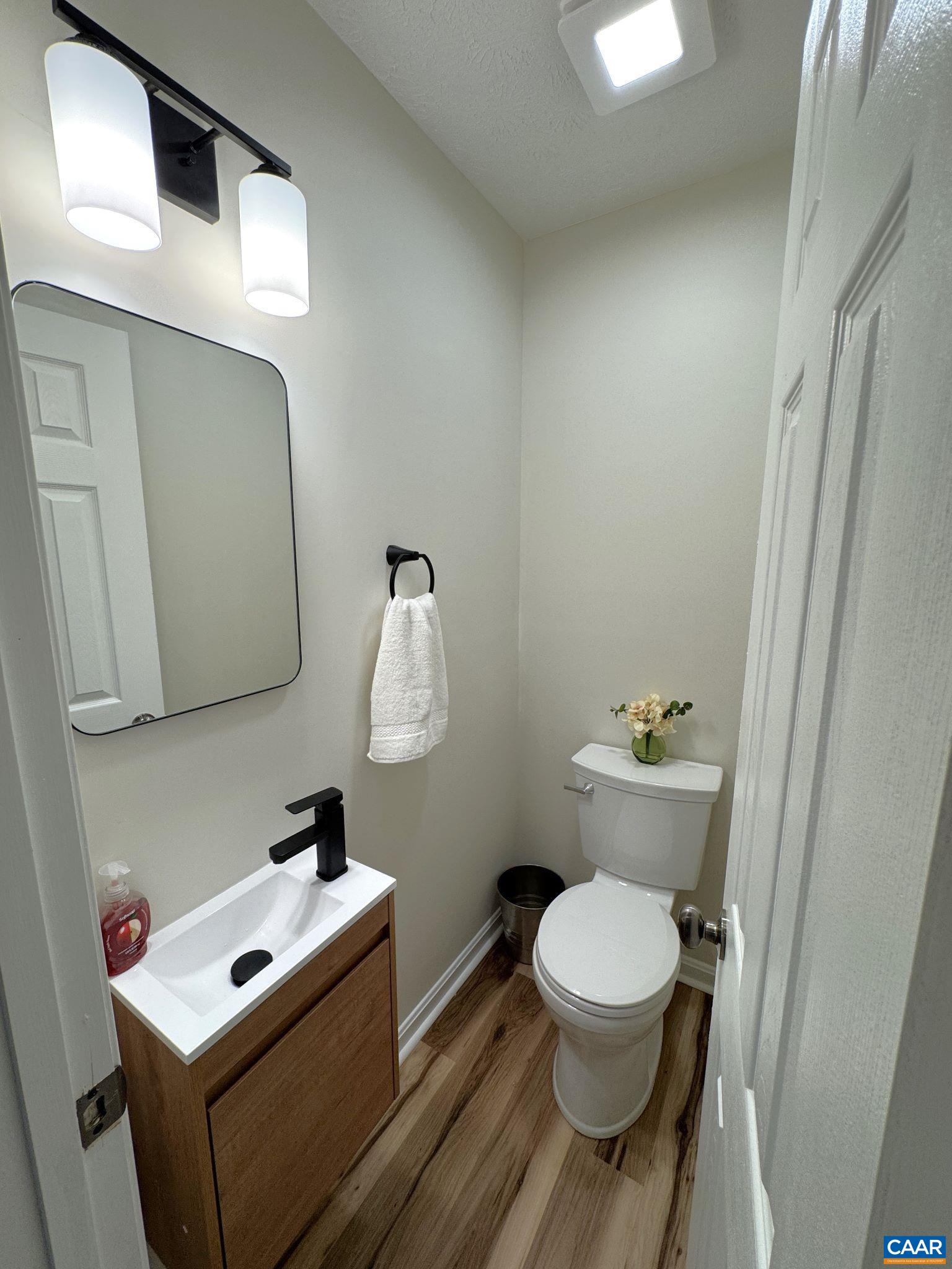 Master Half Bath with Custom Vanity, Hardware and Lighting