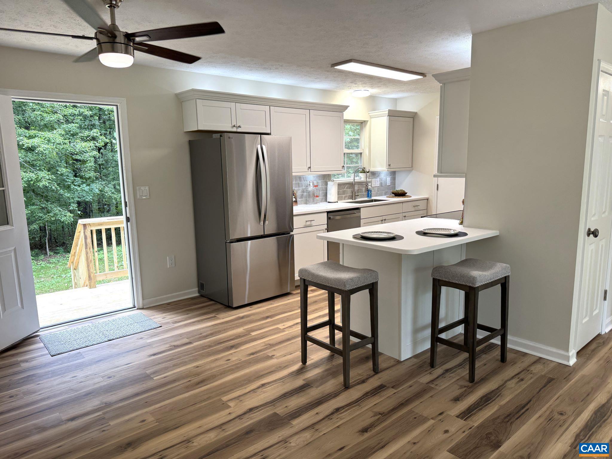 Open Floor Plan - Kitchen and Dining area opens to Private Rear Deck