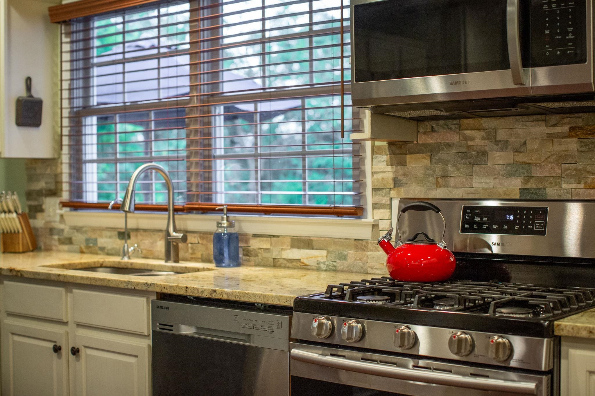 Granite countertop and tiled backsplash!