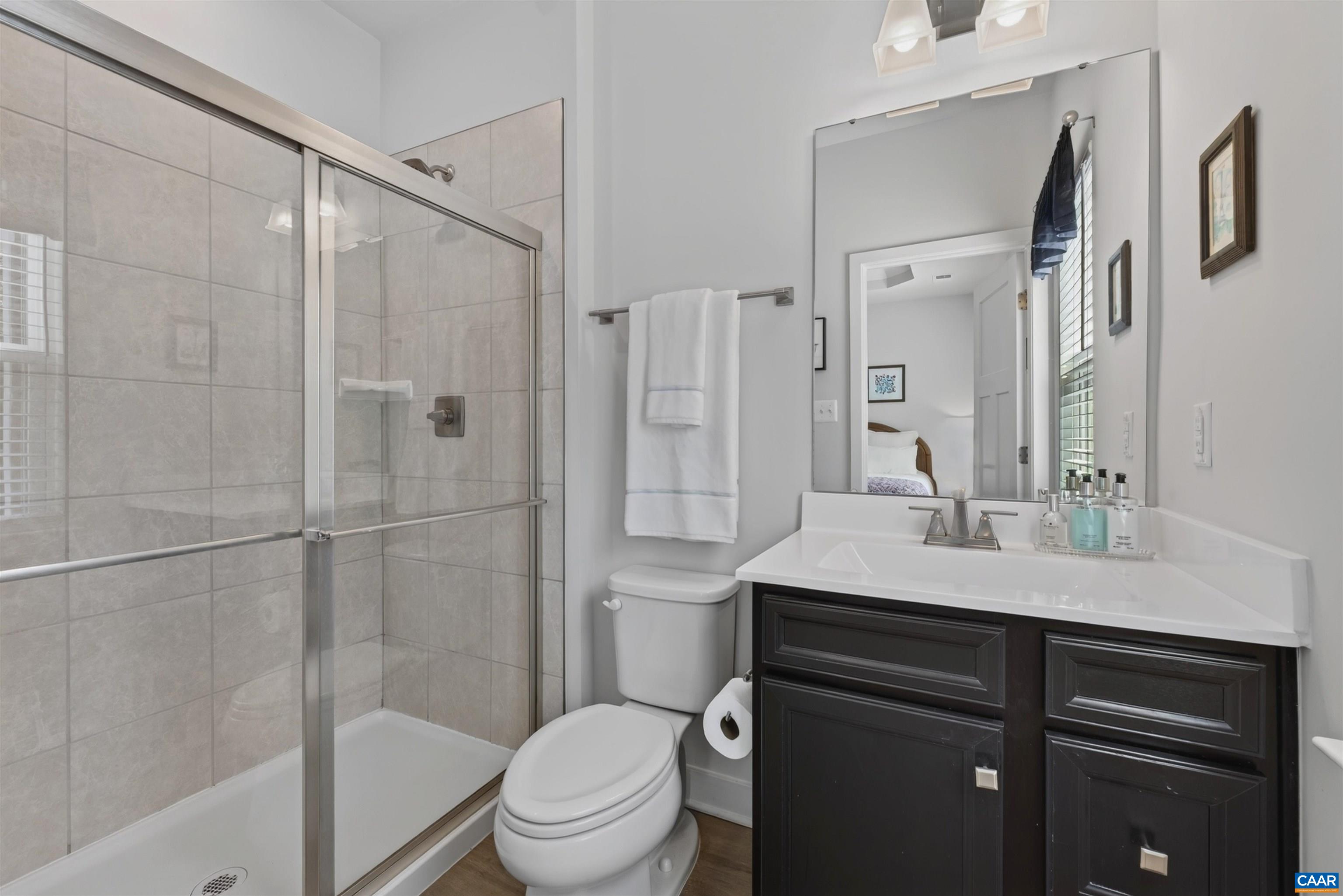 Shower with dual showerheads
