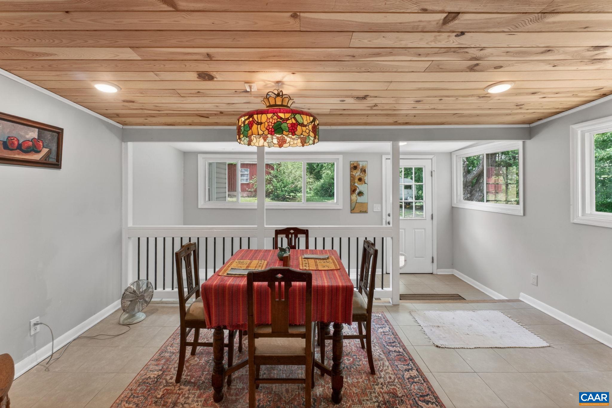 Newly refinished dining room is bright and roomy.
