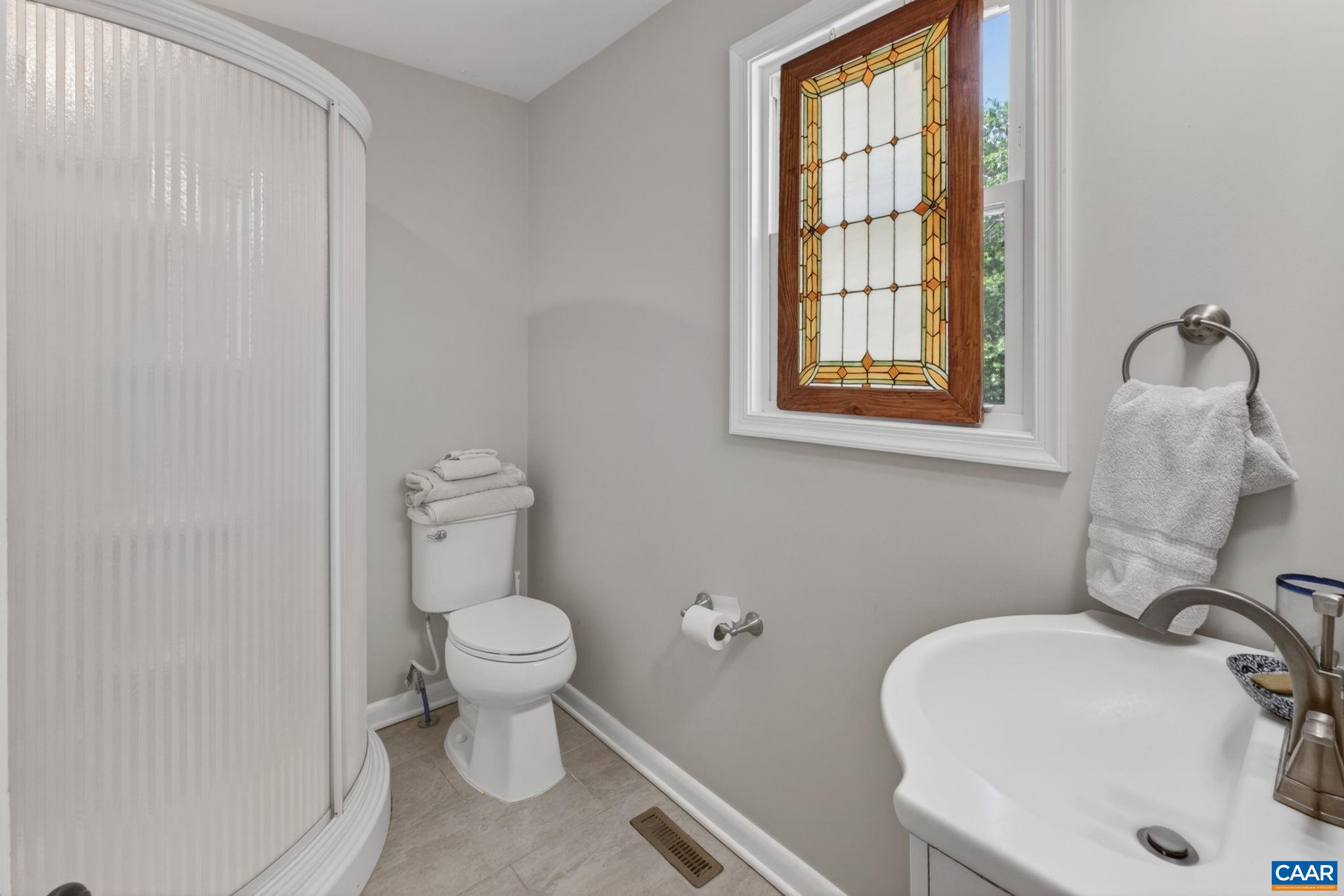 Tiled primary bathroom.