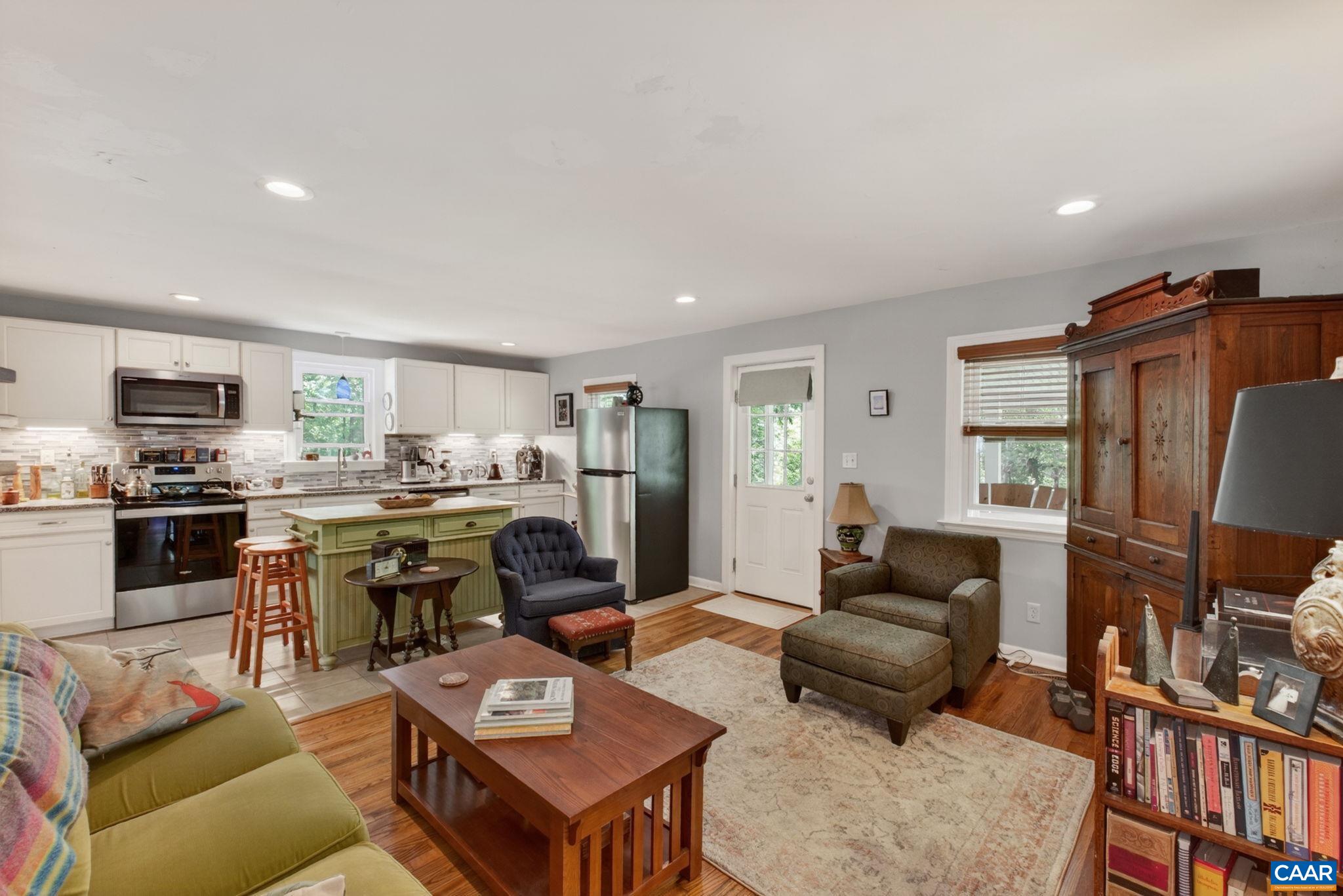 Main living area upon entering the home. Beautiful hardwood floors throughout.