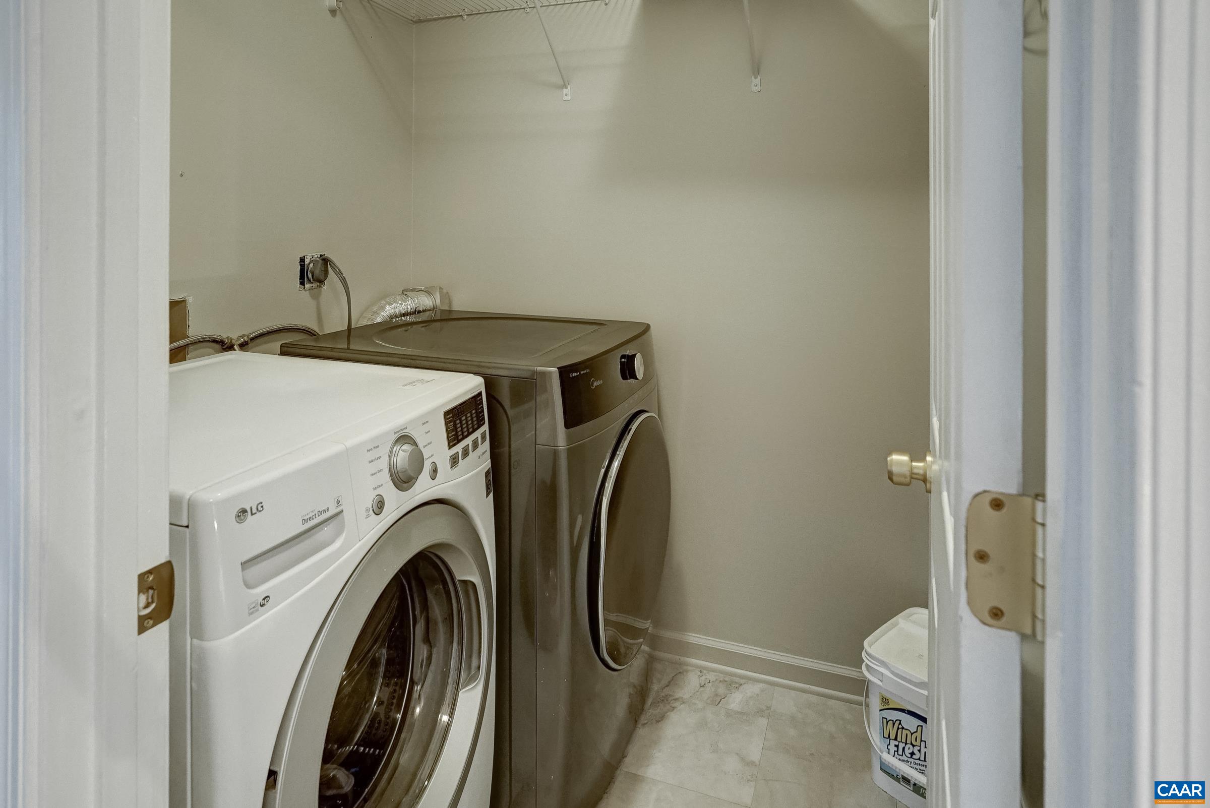 Laundry room wth new washer and dryer. Laundry room wth new washer and dryer.