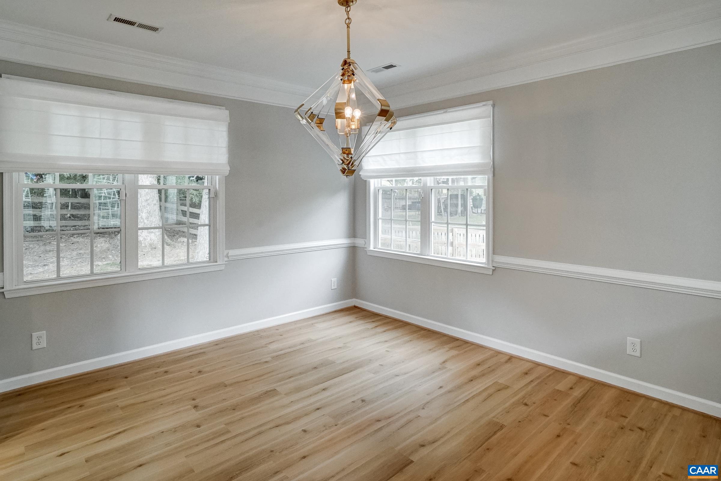 Formal dining room with unique light fixture