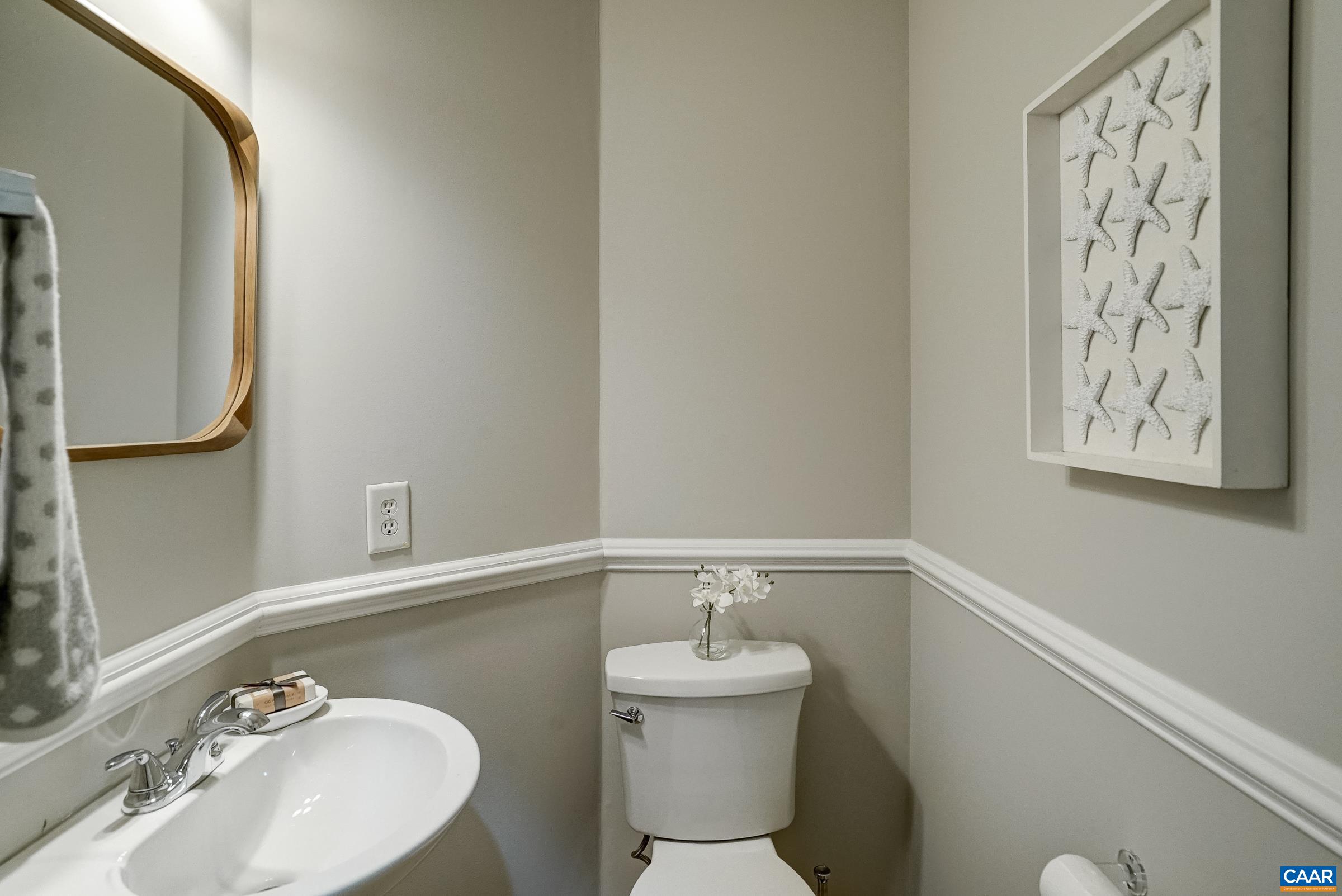 Powder room with chair rail.