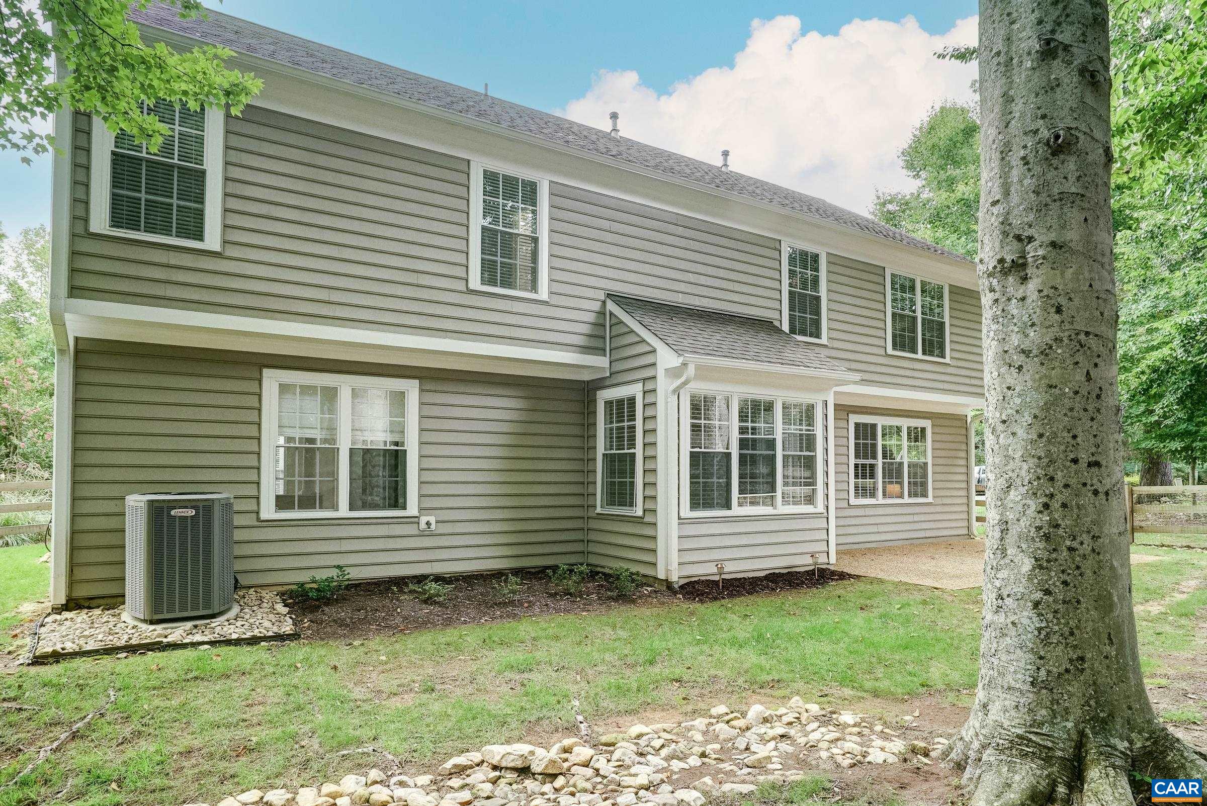Flat, fenced back yard with patio.
