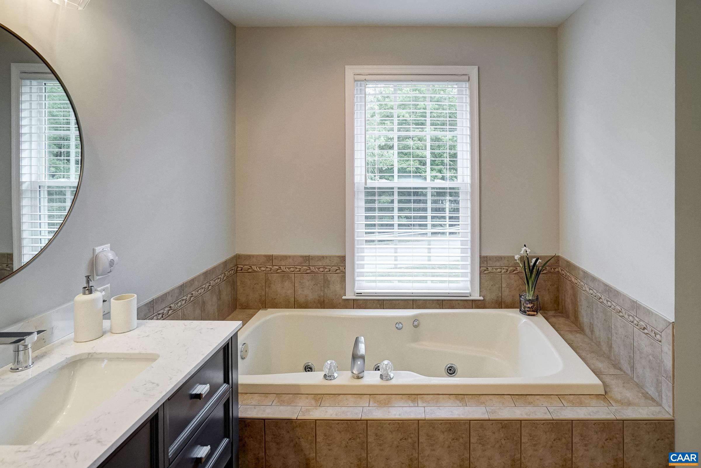 Soaking tub in primary bathroom.