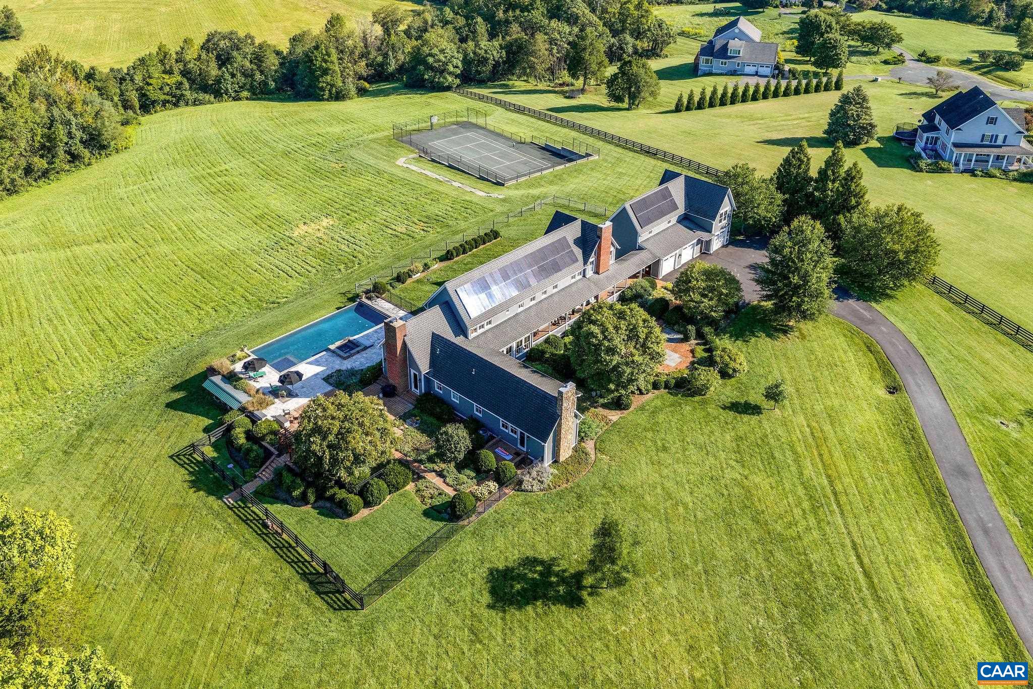 Full compound with vanishing pool, pickleball and basketball court, terraces and 20+ acres of rolling hills and entertaining spaces