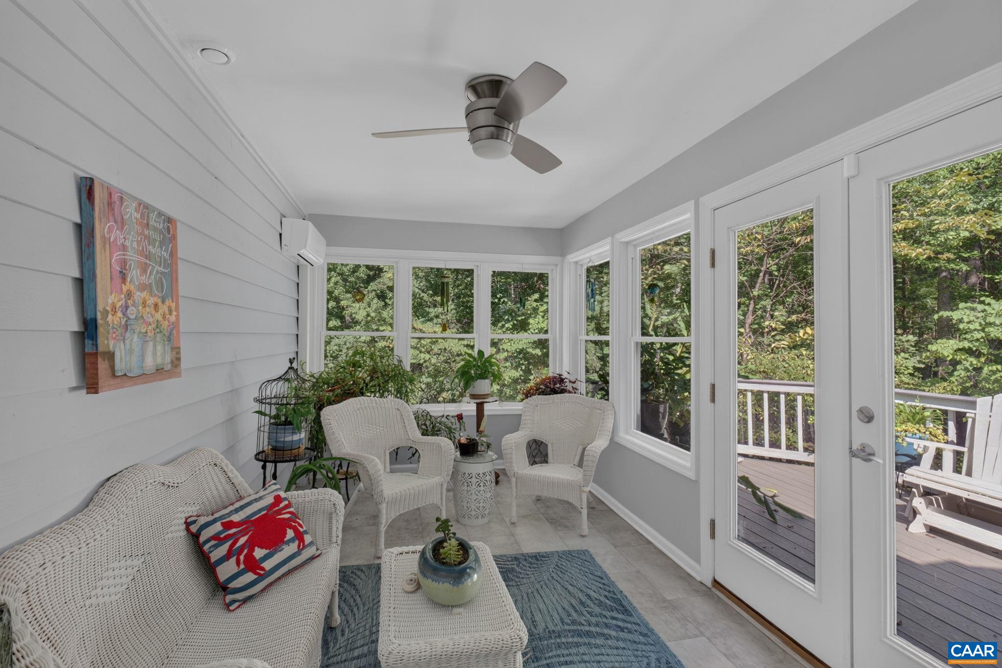 This is a delightful room perfect for those plants you just can't do without.  It's light, bright and airy!  It features french doors leading out to the deck plus a mini split that heats and cools the space.