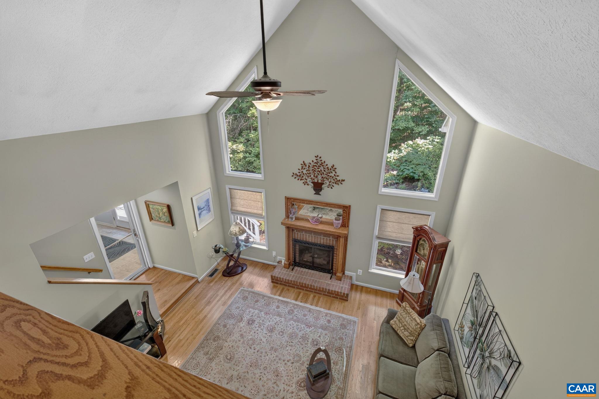 View from Loft looking down into the Great Room. Also showing doorway to Four Season Room.