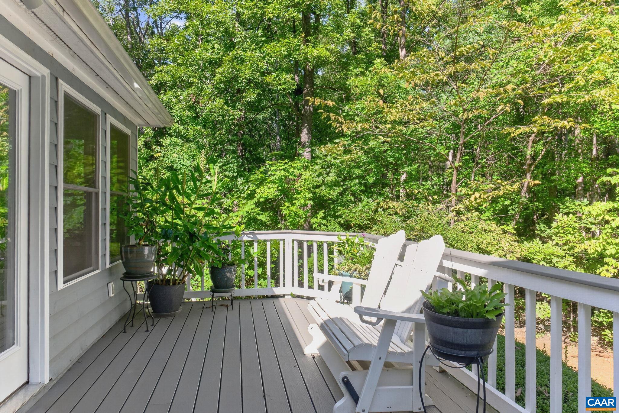 Deck leads into Four Season Room.  There is composite flooring so no need to scrape or paint (rails are also composite)