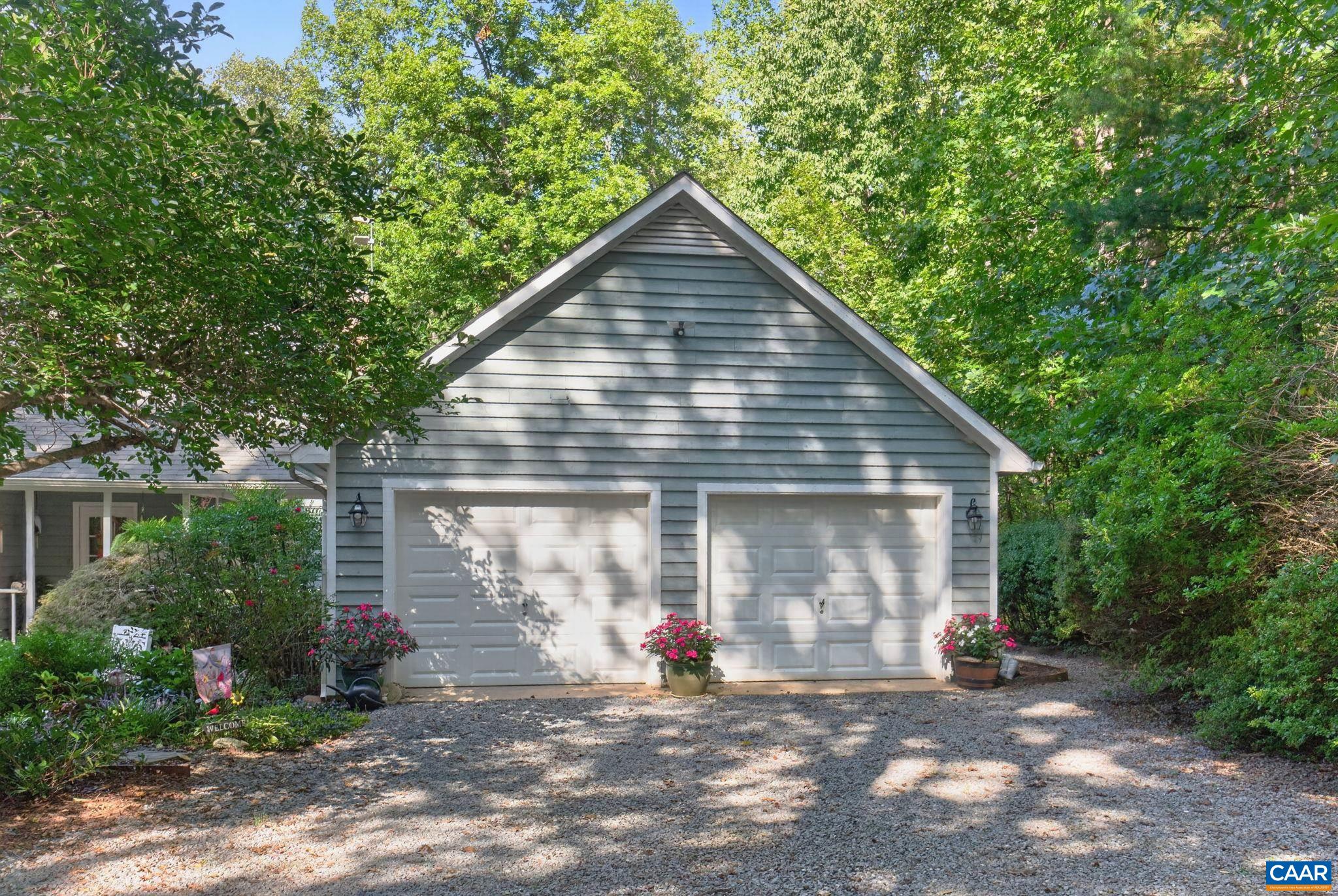 This garage is over sized with plenty of storage space.  There is a partition between the two sides as a owner, at one time, had a hobby on the further side. This partition could be removed to open the space up.