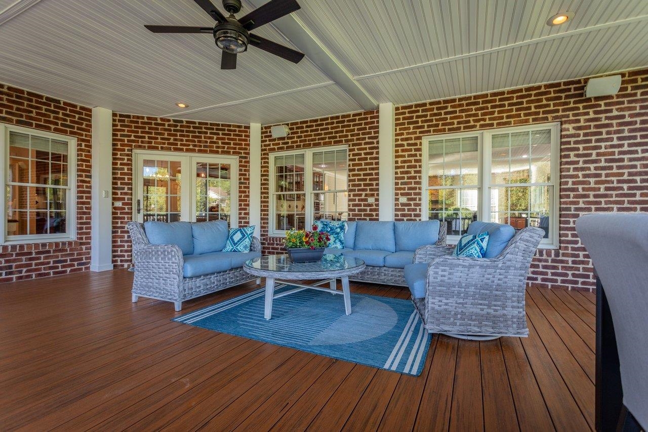 Located directly off the kitchen and great room, this beautiful outdoor living space adjoins an outdoor deck and overlooks a serene, private setting. Located directly off the kitchen and great room, this beautiful outdoor living space adjoins an outdoor deck and overlooks a serene, private setting.