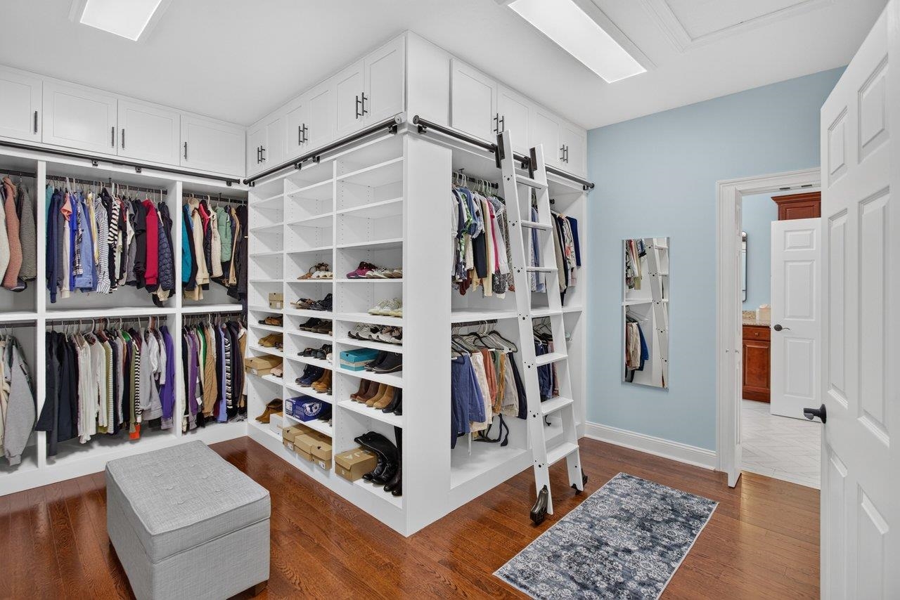 This elegant walk-in closet is one-of-a-kind. Gorgeous built-ins and upper storage areas make room for ALL of your clothes and shoes! This elegant walk-in closet is one-of-a-kind. Gorgeous built-ins and upper storage areas make room for ALL of your clothes and shoes!