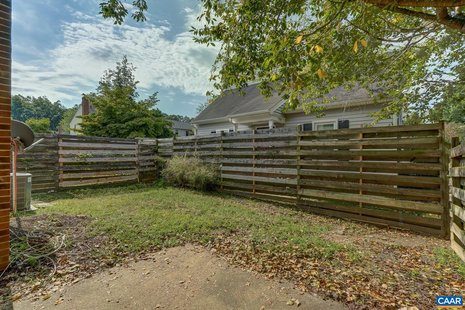 Fenced back yard with patio.
