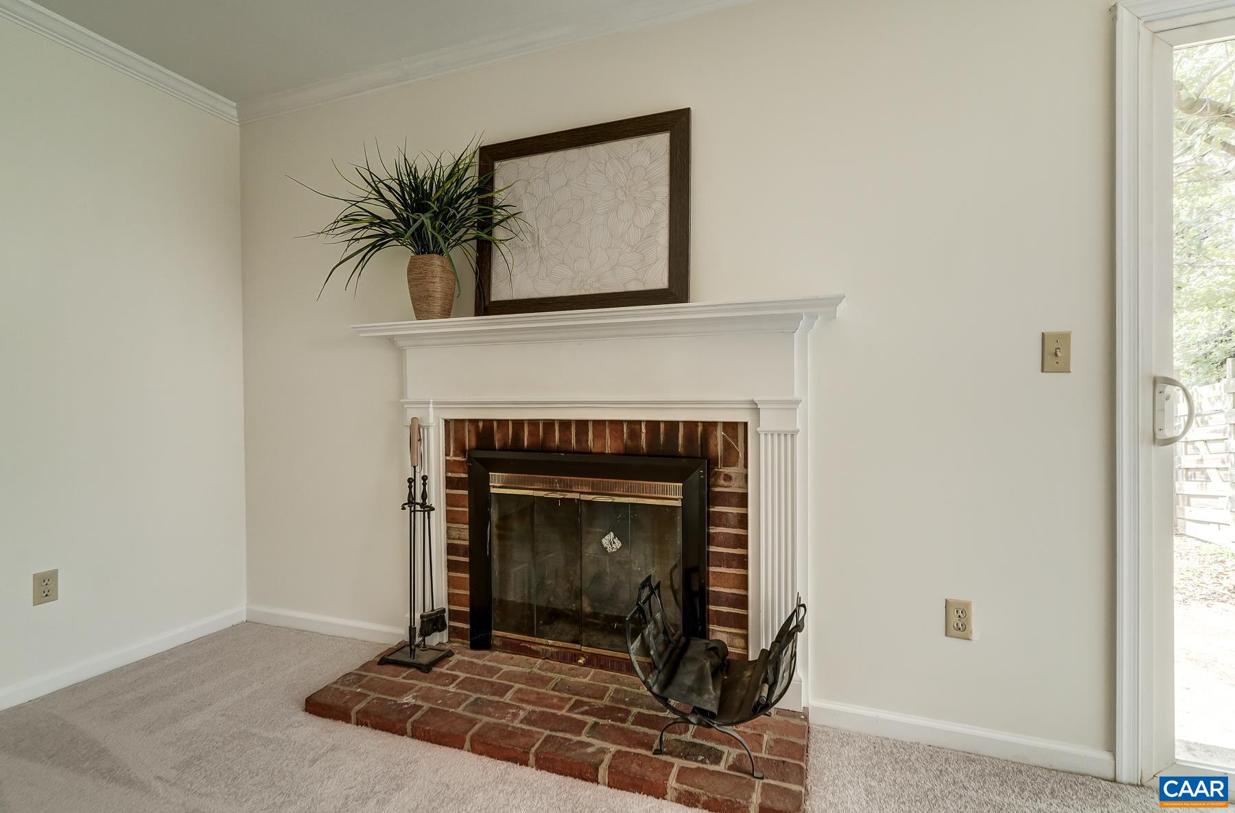 Brick wood-burning fireplace.