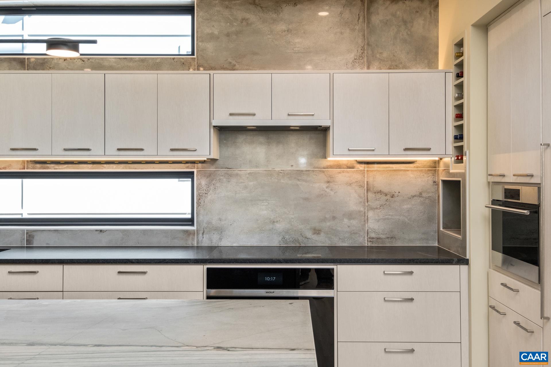 Custom cabinetry, quartz counters and built-in appliances.
