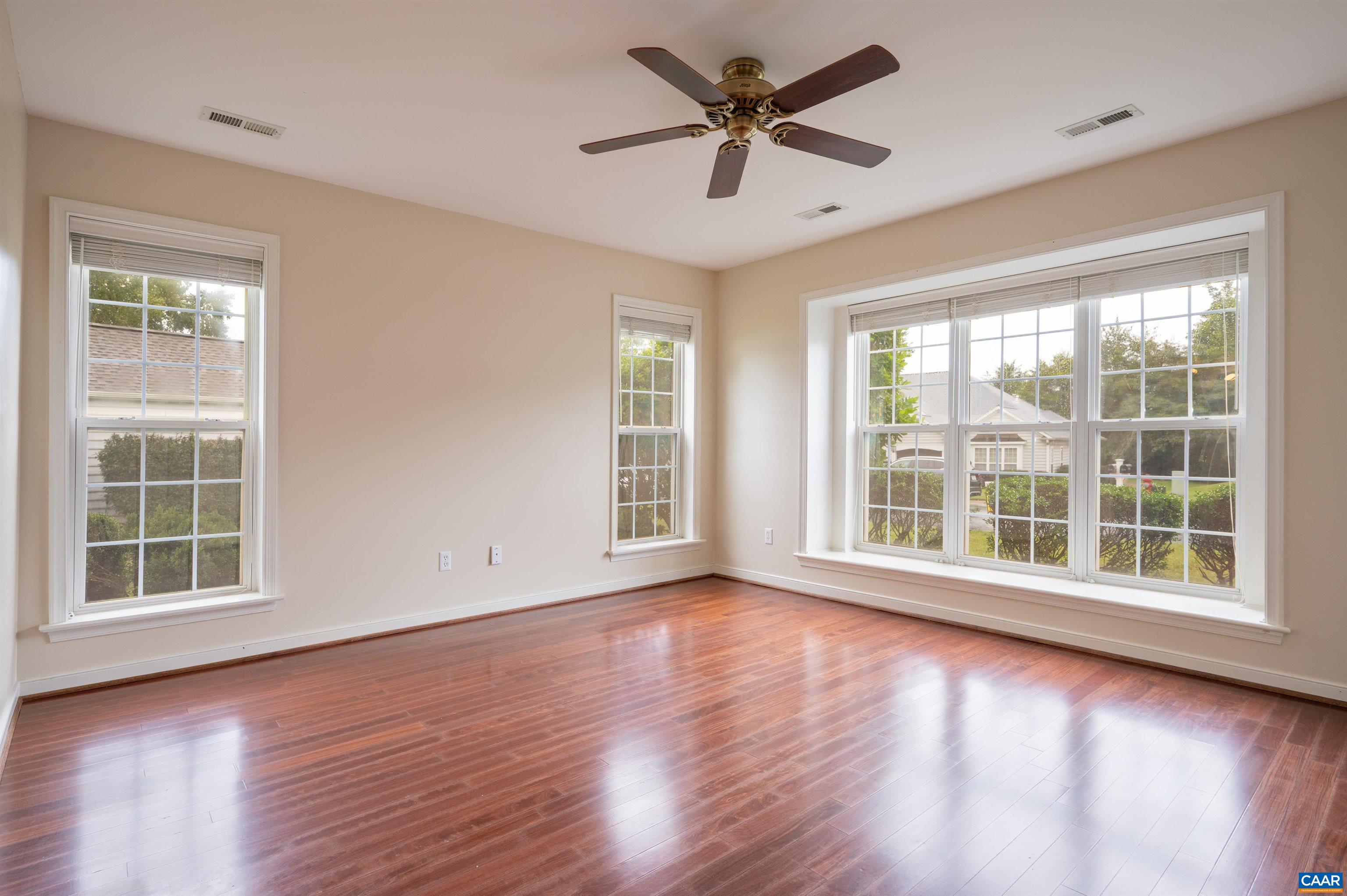 With double closets, ceiling fan and lots of windows, this spacious bedroom is a true retreat. With double closets, ceiling fan and lots of windows, this spacious bedroom is a true retreat.