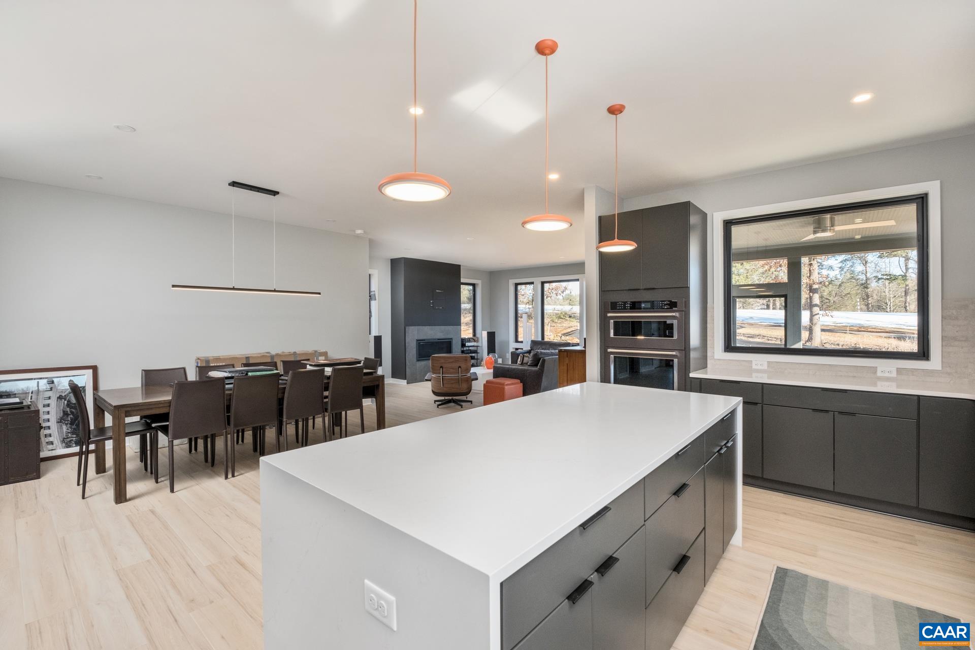 Open floor plan with kitchen flowing to dining room is great for entertaining.