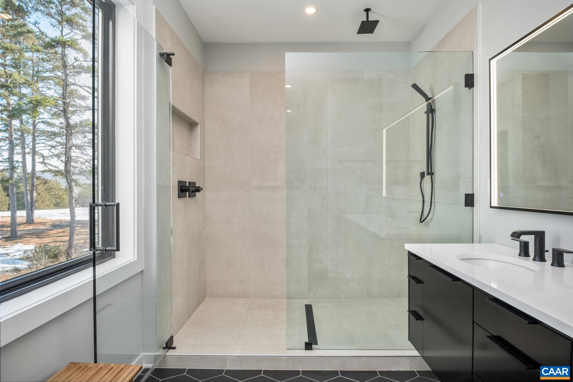 Relax in the large walk-in shower with rain head.