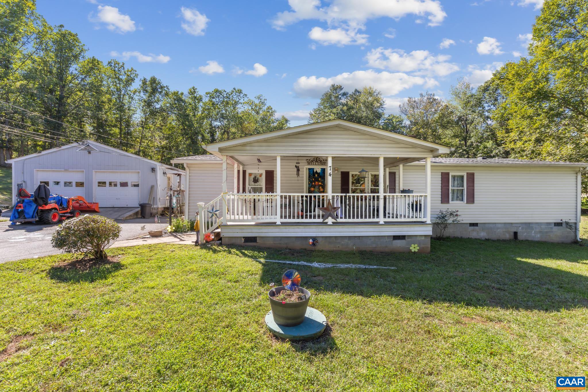Charming 1,891 sq ft home situated on two tranquil lots totaling 6.73 acres! Features a spacious front porch, attached garage, and serene open grounds with plenty of room to relax or expand. A perfect blend of peaceful country living and versatility! Charming 1,891 sq ft home situated on two tranquil lots totaling 6.73 acres! Features a spacious front porch, attached garage, and serene open grounds with plenty of room to relax or expand. A perfect blend of peaceful country living and versatility!