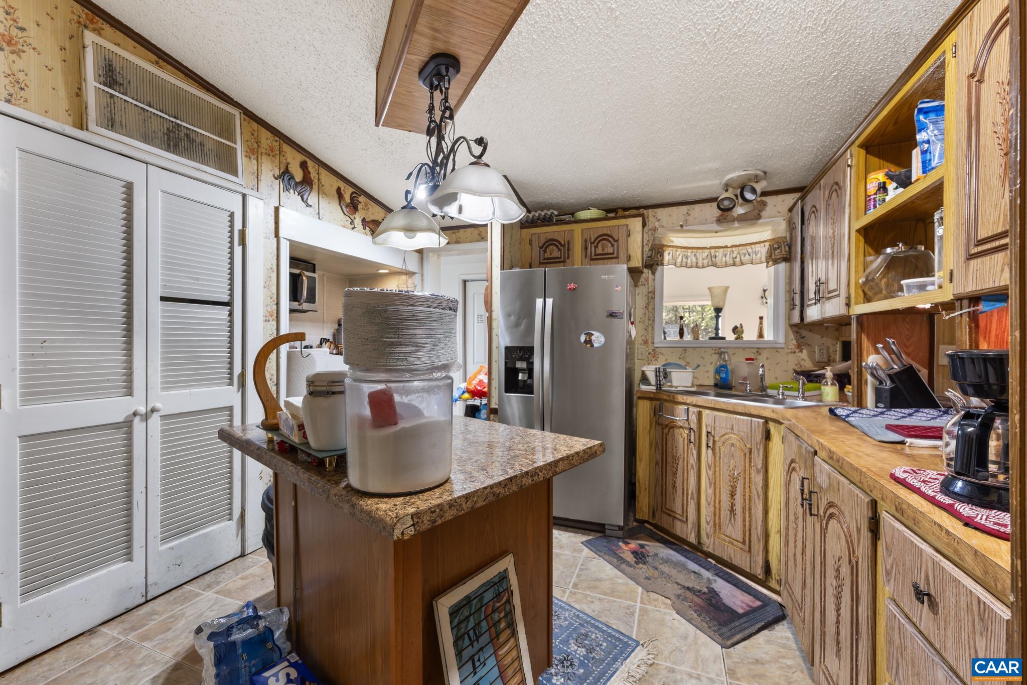 The heart of the home! This warm, spacious kitchen features an expansive center island, ample cabinetry, and charming rustic beam accents. Perfectly designed for cooking, storage, and gathering, it’s an ideal space for everyday family life. No dishwasher. The heart of the home! This warm, spacious kitchen features an expansive center island, ample cabinetry, and charming rustic beam accents. Perfectly designed for cooking, storage, and gathering, it’s an ideal space for everyday family life. No dishwasher.