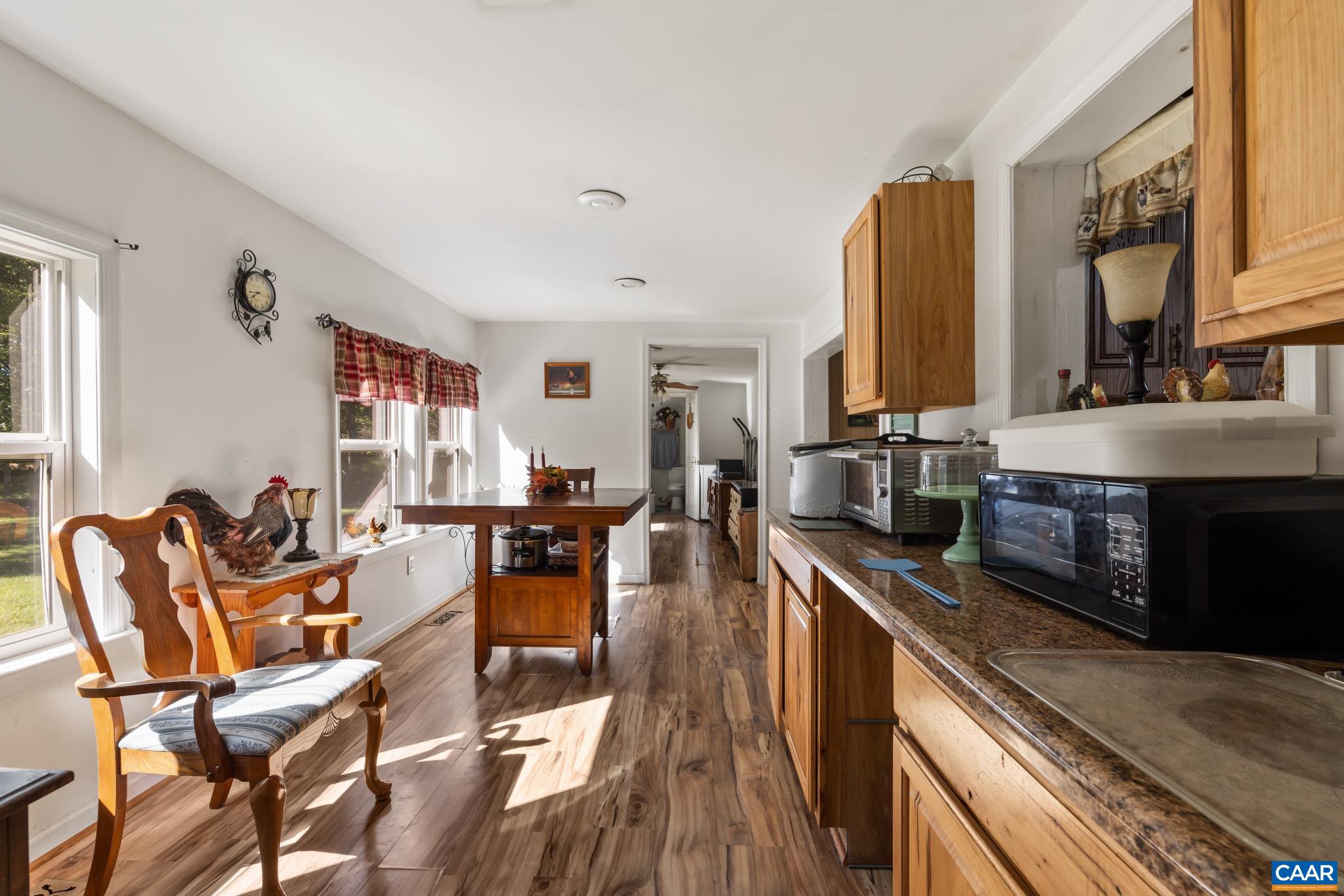 Expand your culinary possibilities in this convenient kitchen extension, located just through the pass-through window. Featuring extra cabinetry and generous counter space, it is perfect for housing microwaves, air fryers, and small appliances. Expand your culinary possibilities in this convenient kitchen extension, located just through the pass-through window. Featuring extra cabinetry and generous counter space, it is perfect for housing microwaves, air fryers, and small appliances.