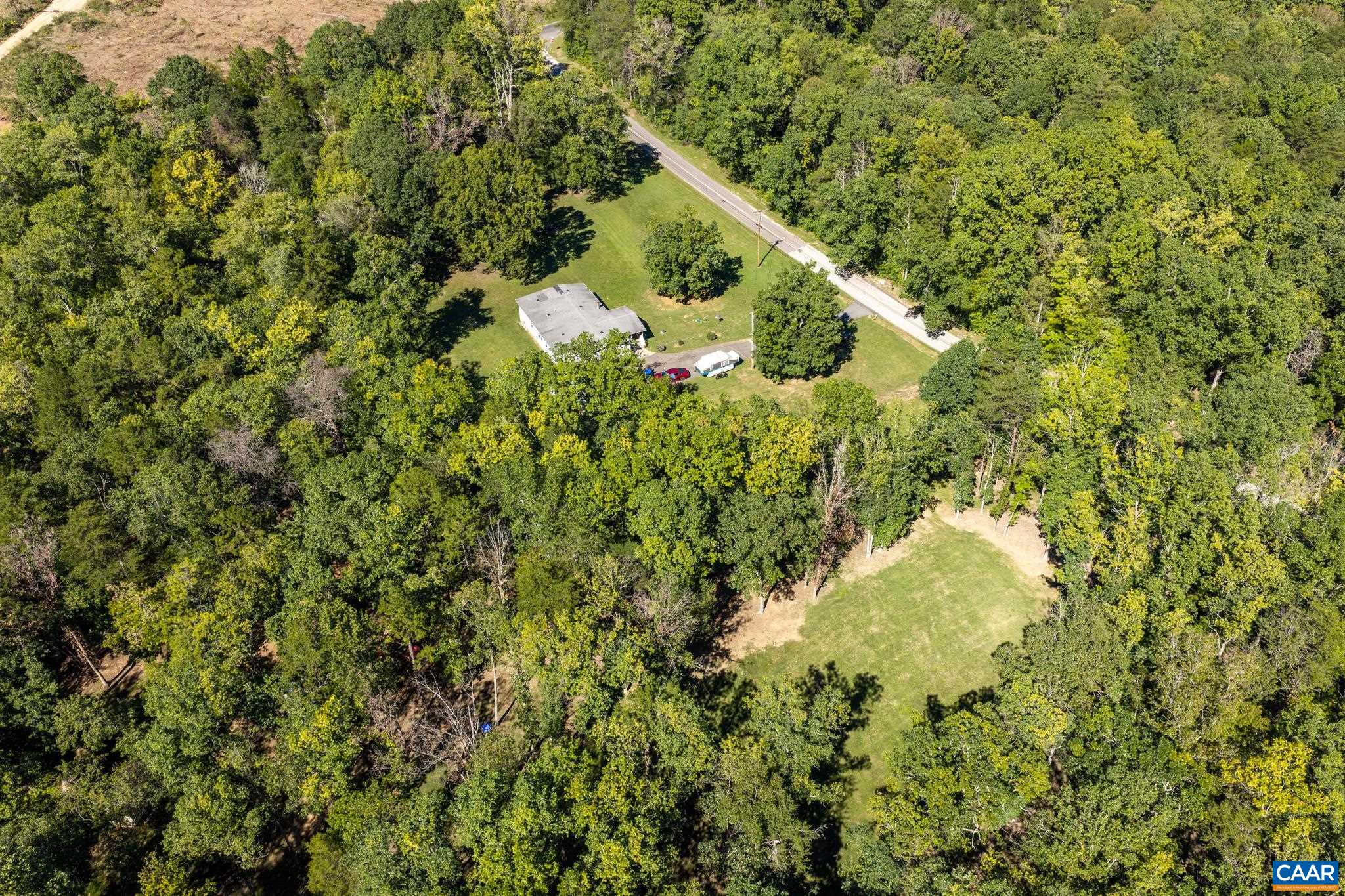 Capturing both adjacent lots in one spectacular aerial view, this 6.73-acre property offers 1,891 sq ft of home paired with incredible space and privacy. Surrounded by lush greenery and woods, it's the ultimate canvas for your peaceful sanctuary! Capturing both adjacent lots in one spectacular aerial view, this 6.73-acre property offers 1,891 sq ft of home paired with incredible space and privacy. Surrounded by lush greenery and woods, it's the ultimate canvas for your peaceful sanctuary!
