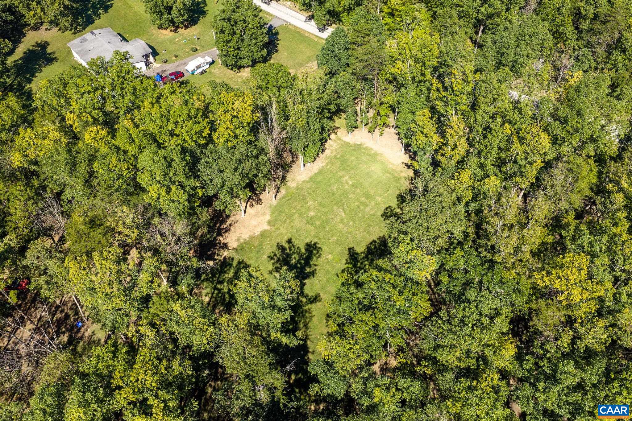 Experience ultimate privacy with 6.73 total acres across two lots! Featuring a 1,891 sq ft home with garage on 3.28 acres, plus an adjacent 3.45-acre vacant lot. Endless space, mature trees, and pure tranquility await your vision! Experience ultimate privacy with 6.73 total acres across two lots! Featuring a 1,891 sq ft home with garage on 3.28 acres, plus an adjacent 3.45-acre vacant lot. Endless space, mature trees, and pure tranquility await your vision!