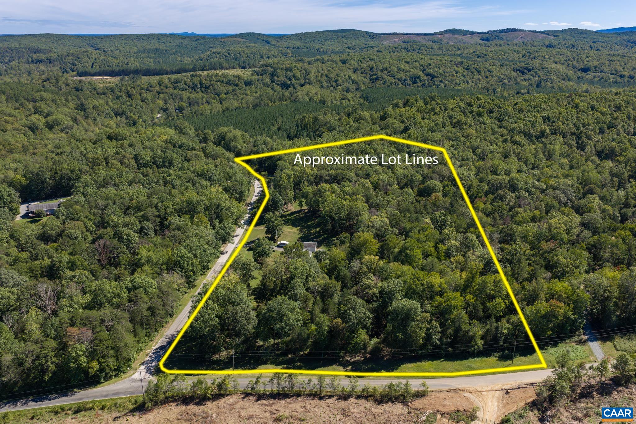 This aerial shot showcases the entire 6.73-acre property, combining both distinct lots into one vast, private haven. Surrounded by lush forest and scenic hills, it offers unmatched space, natural beauty, and boundless freedom for your vision! This aerial shot showcases the entire 6.73-acre property, combining both distinct lots into one vast, private haven. Surrounded by lush forest and scenic hills, it offers unmatched space, natural beauty, and boundless freedom for your vision!