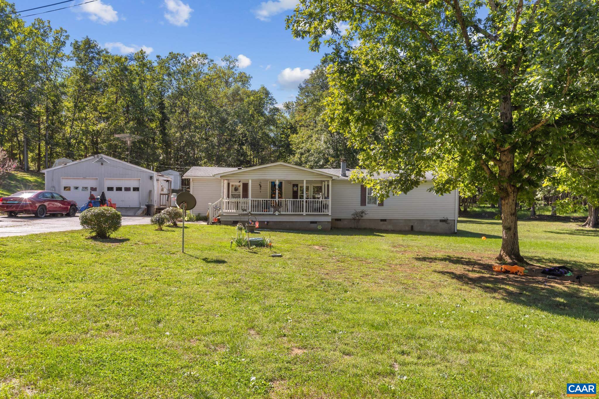 Highlighting a impressive 2-car detached garage equipped with its own full bathroom! Perfectly paired with a cozy home on 6.73 total acres, this setup offers endless potential for a workshop, guest suite, studio, or ultimate hobby space. Highlighting a impressive 2-car detached garage equipped with its own full bathroom! Perfectly paired with a cozy home on 6.73 total acres, this setup offers endless potential for a workshop, guest suite, studio, or ultimate hobby space.