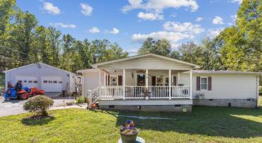 Charming 1,891 sq ft home situated on two tranquil lots totaling 6.73 acres! Features a spacious front porch, attached garage, and serene open grounds with plenty of room to relax or expand. A perfect blend of peaceful country living and versatility!