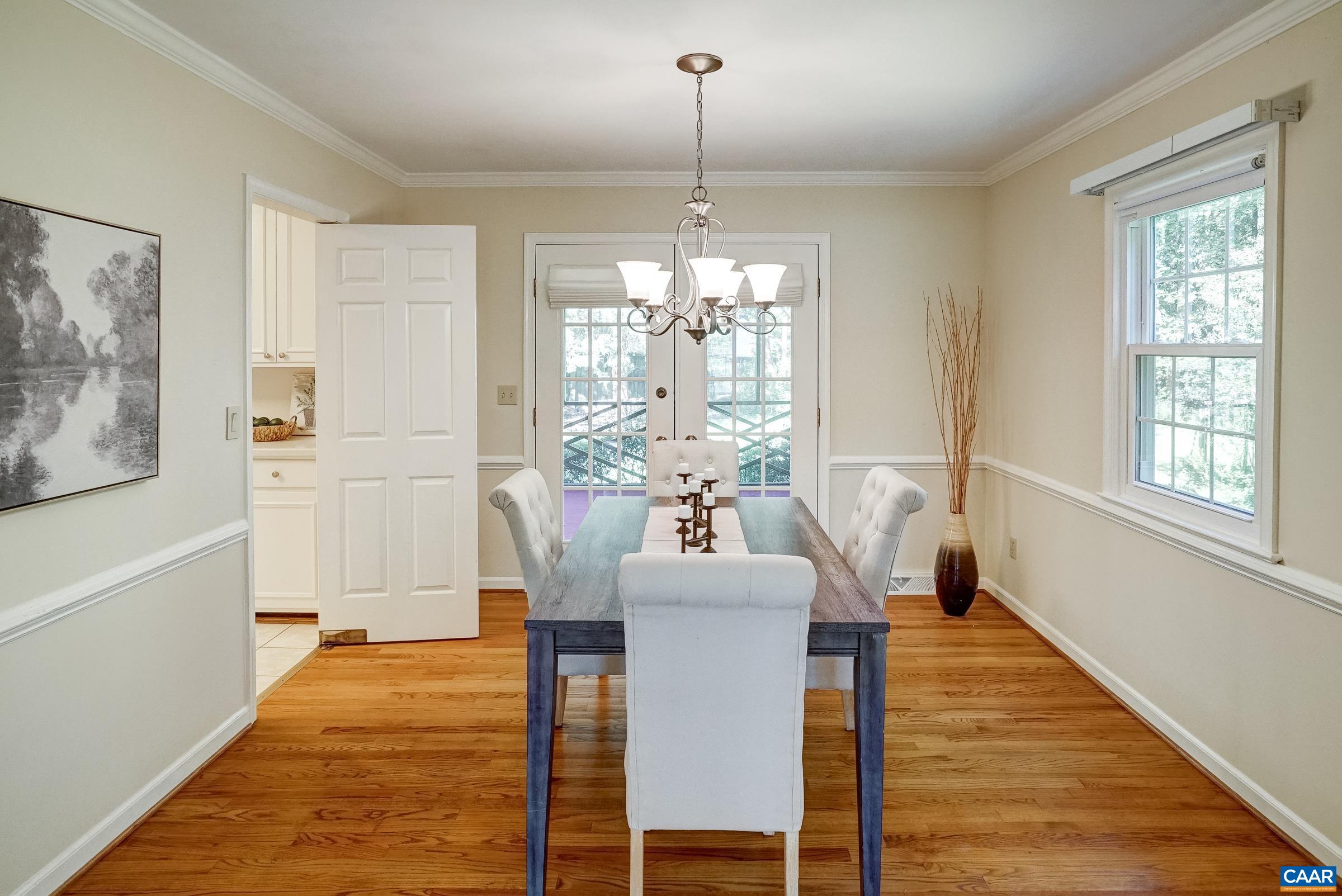 Formal dining room with chair rail and space to gather for casual or formal meals. Formal dining room with chair rail and space to gather for casual or formal meals.