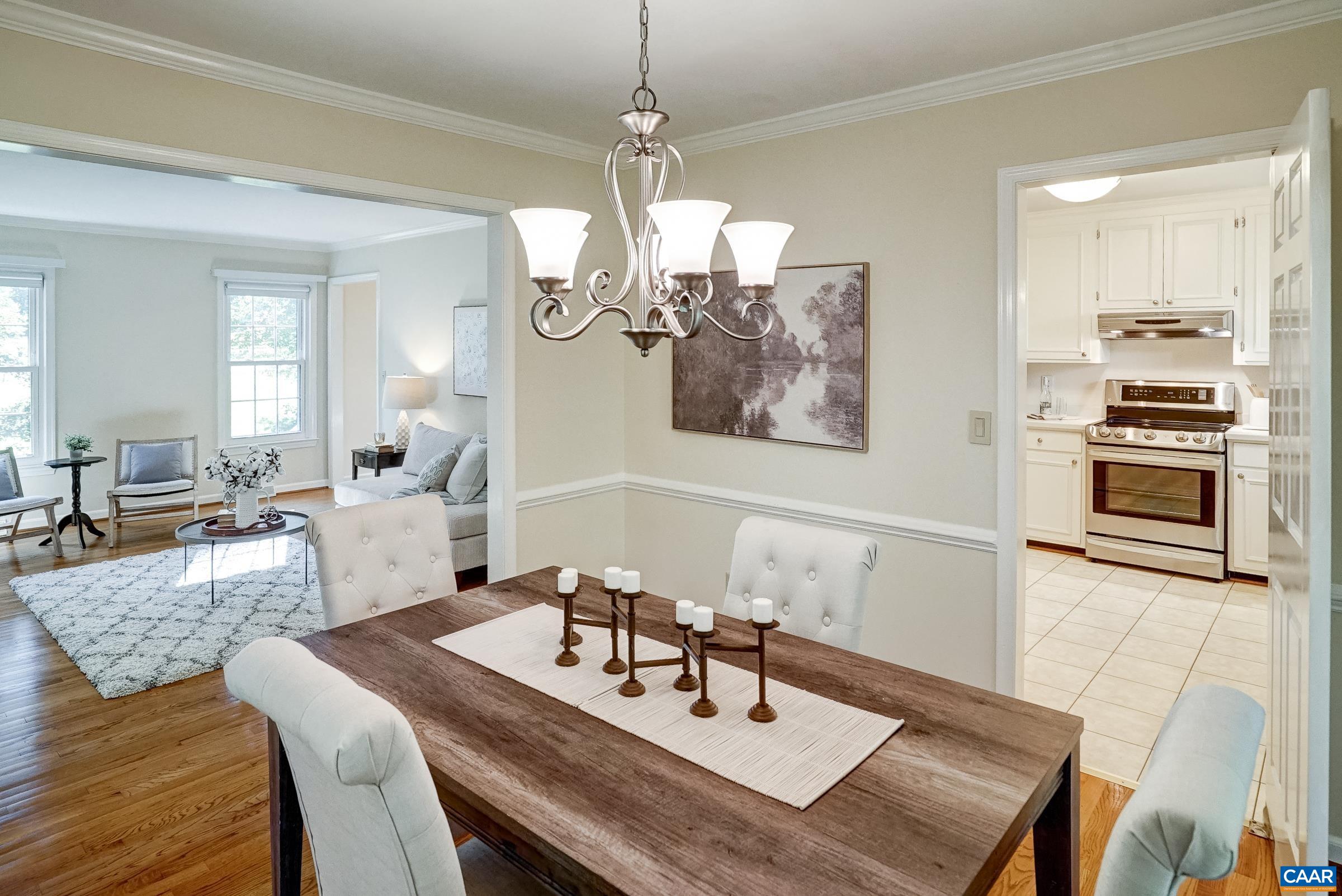 Dining room with swinging door to kitchen. Dining room with swinging door to kitchen.