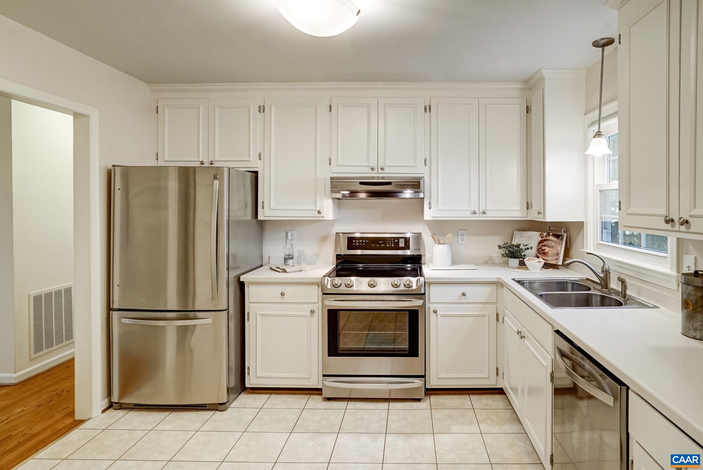 Updated kitchen features white cabinets, Corian countertops and stainless appliances. Updated kitchen features white cabinets, Corian countertops and stainless appliances.
