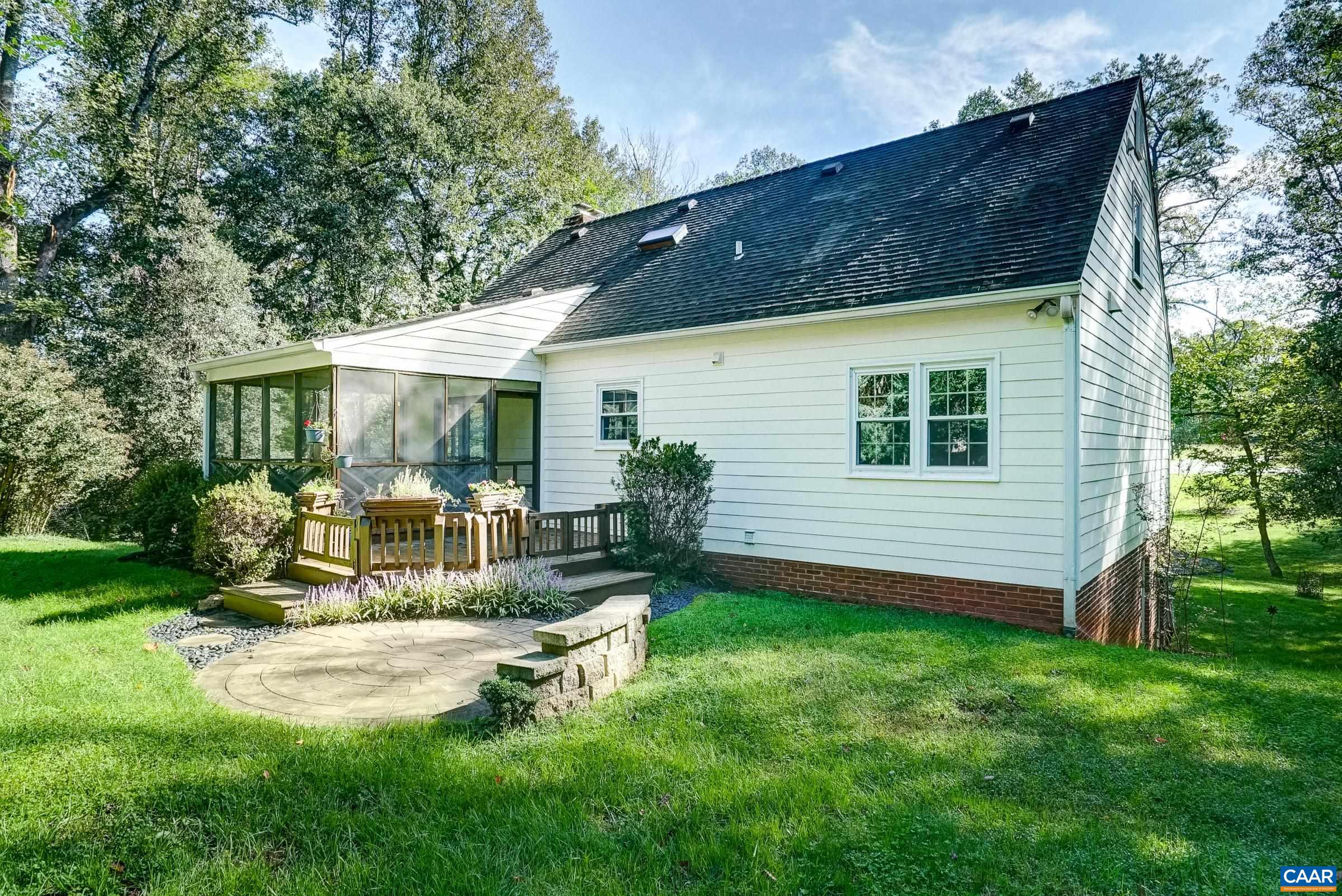 Flat rear yard with paver patio, deck and screened porch. Flat rear yard with paver patio, deck and screened porch.