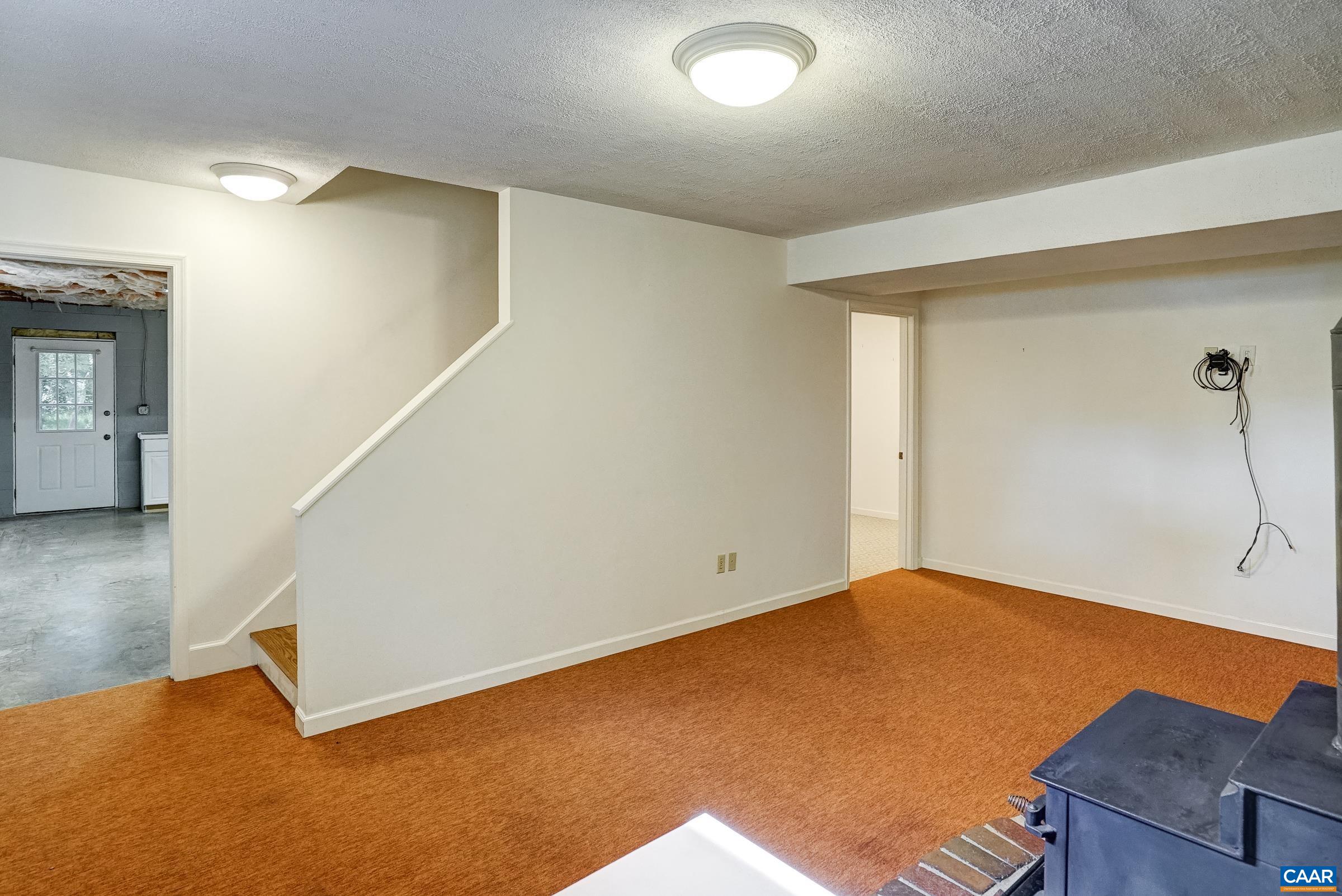 Walk out basement features a large rec room Walk out basement features a large rec room
