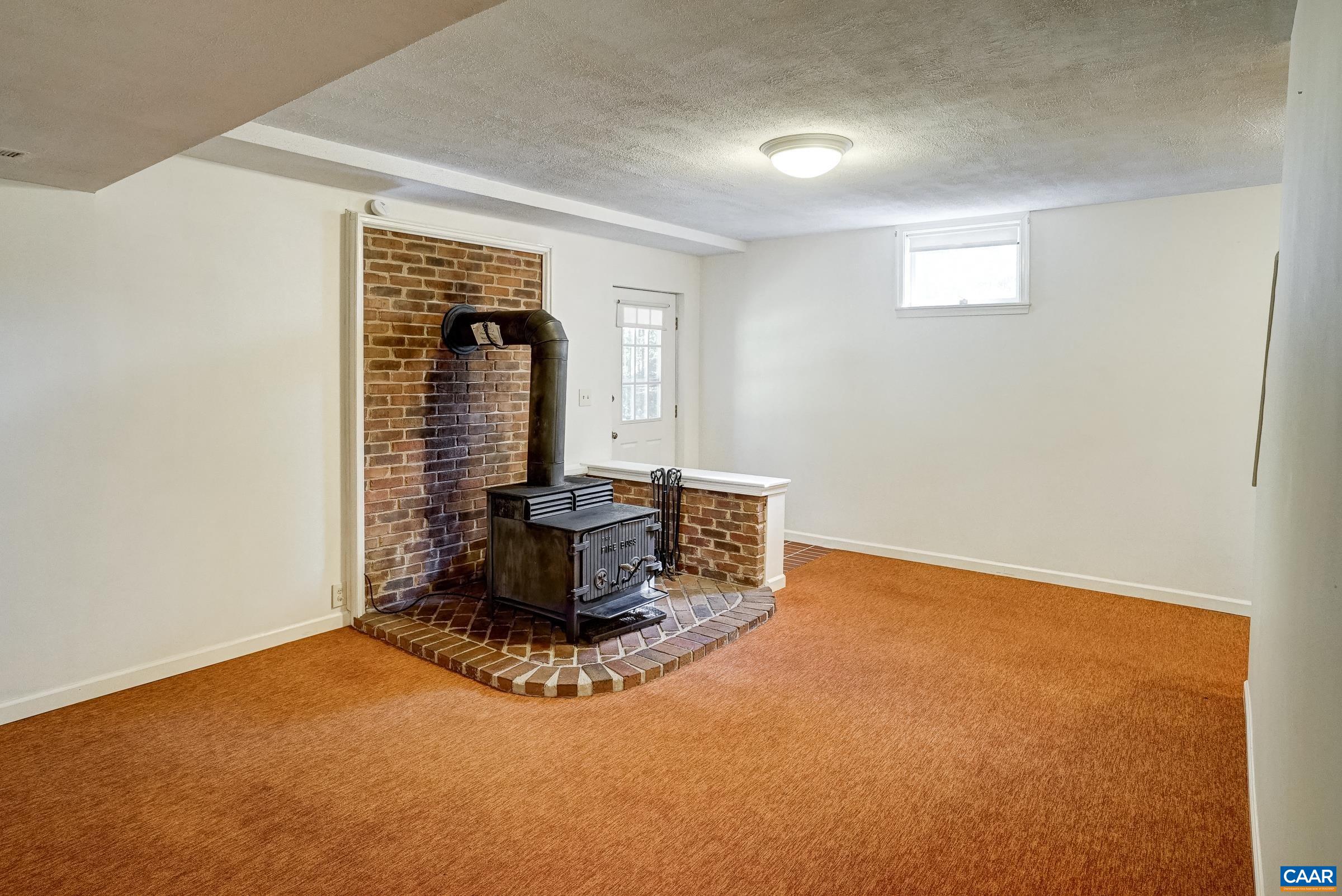 Wood stove in basement. Wood stove in basement.