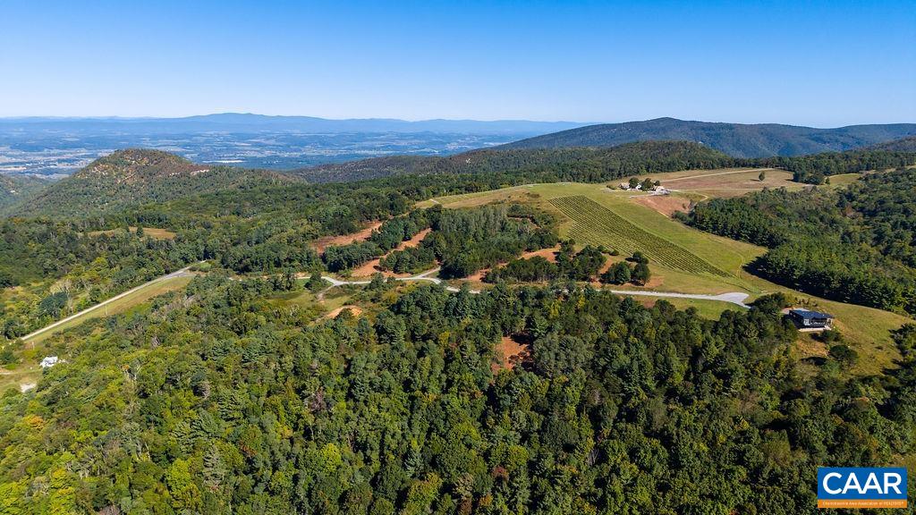 Layered ridges to the horizon; the view is protected by National Forest and easement land. Layered ridges to the horizon; the view is protected by National Forest and easement land.