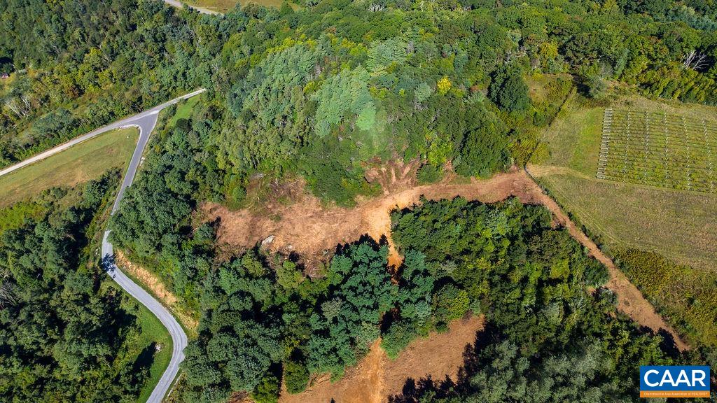 Road, driveway and cleared site; fiber and electricity are in place. Road, driveway and cleared site; fiber and electricity are in place.
