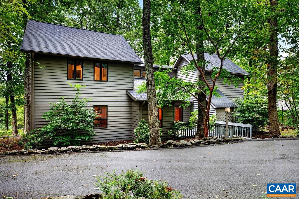 An almost-level paved driveway provides easy access and plenty of parking for family and guests—a welcome convenience in a mountain home.