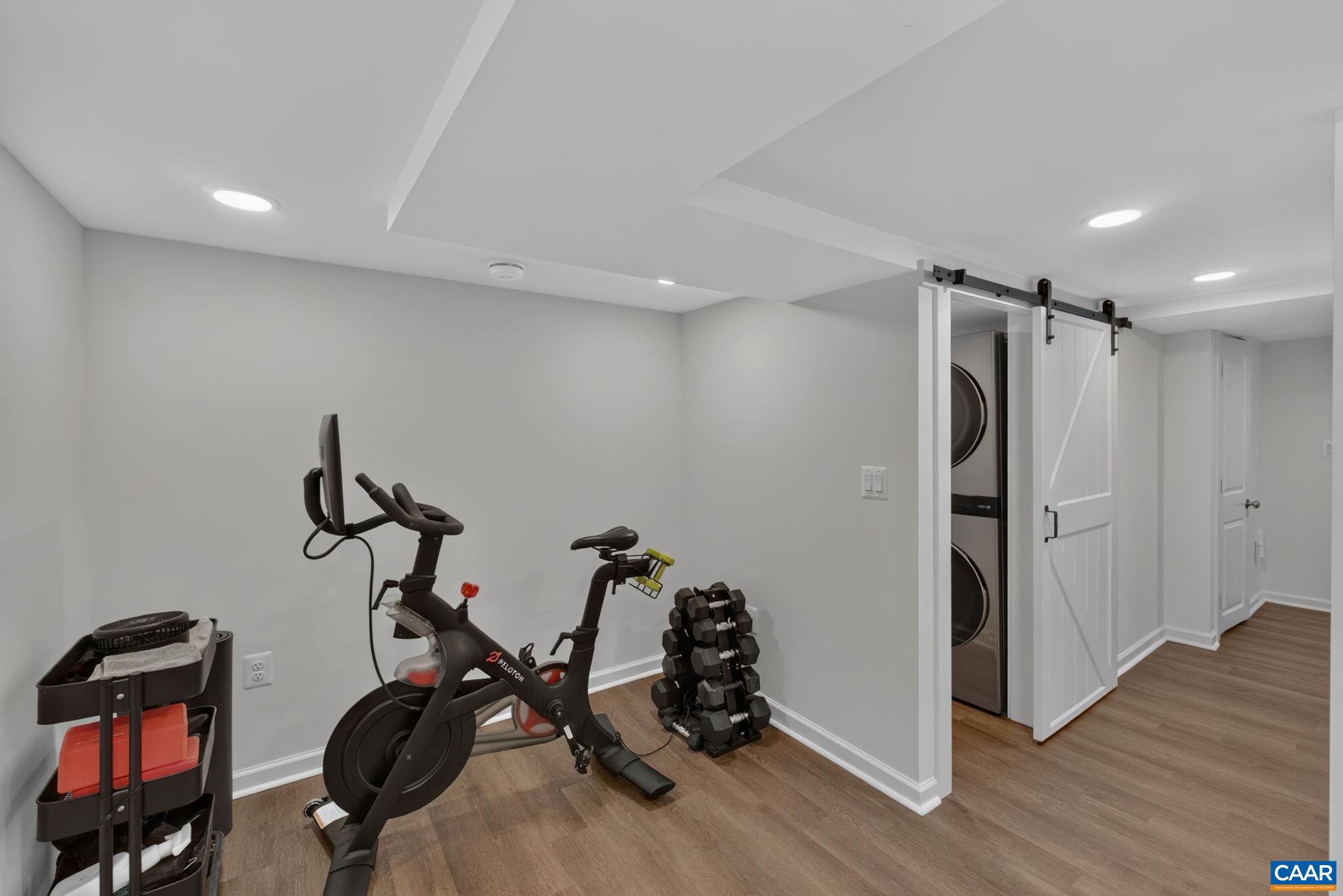The basement was fully gutted & remodeled in fall 2024. Step down to find an exercise/bonus space. The basement was fully gutted & remodeled in fall 2024. Step down to find an exercise/bonus space.
