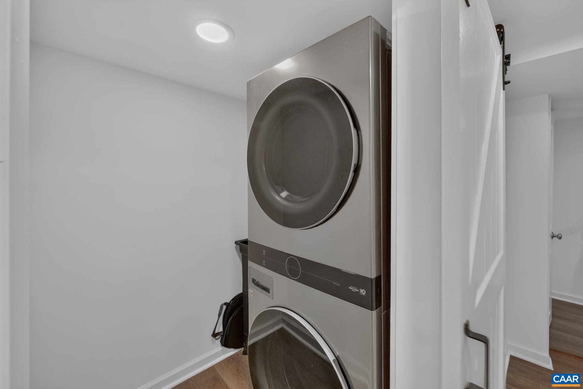 Laundry room includes stackable washer & dryer (2024). Laundry room includes stackable washer & dryer (2024).