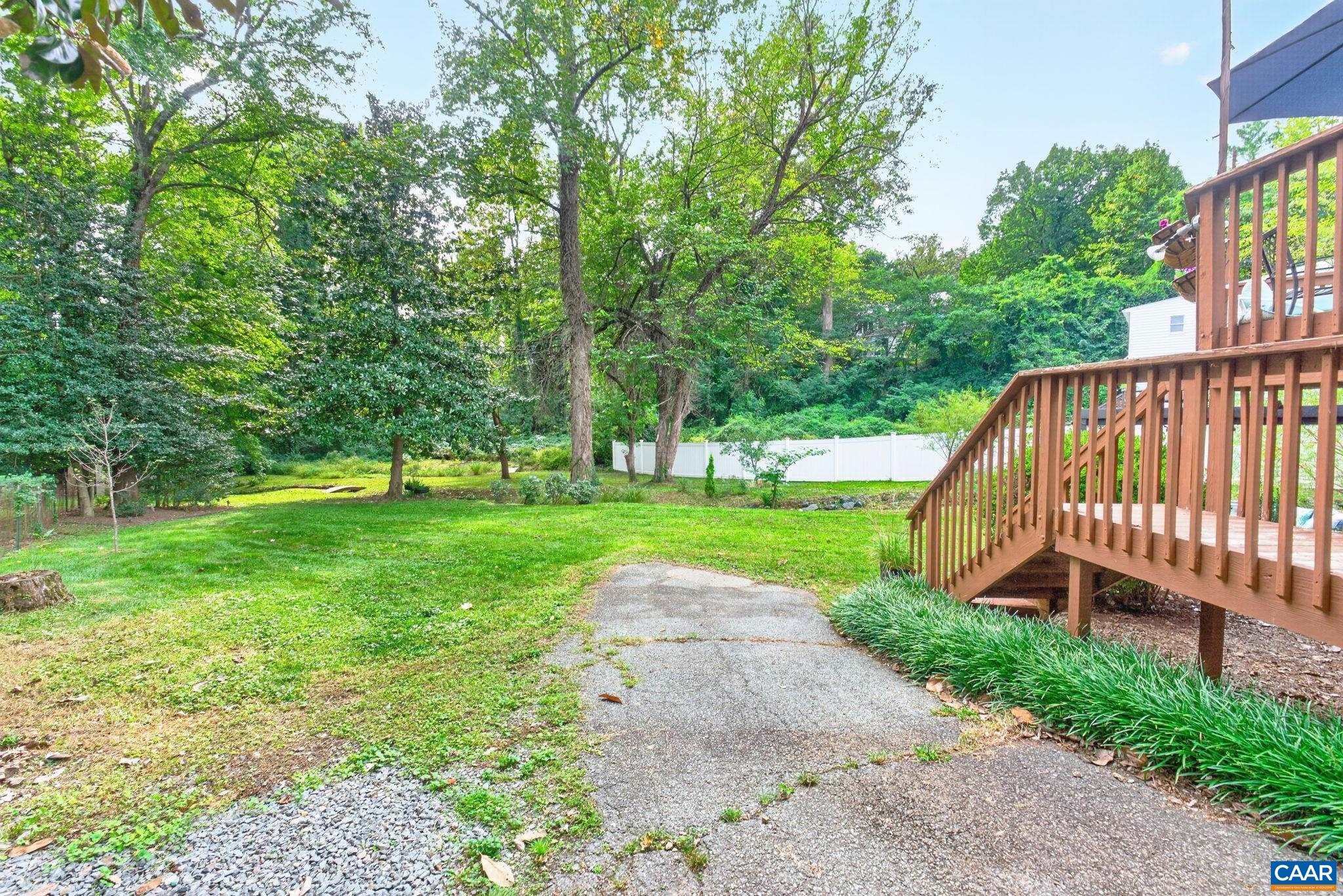 On the other side of the yard, find steps to the back deck. On the other side of the yard, find steps to the back deck.
