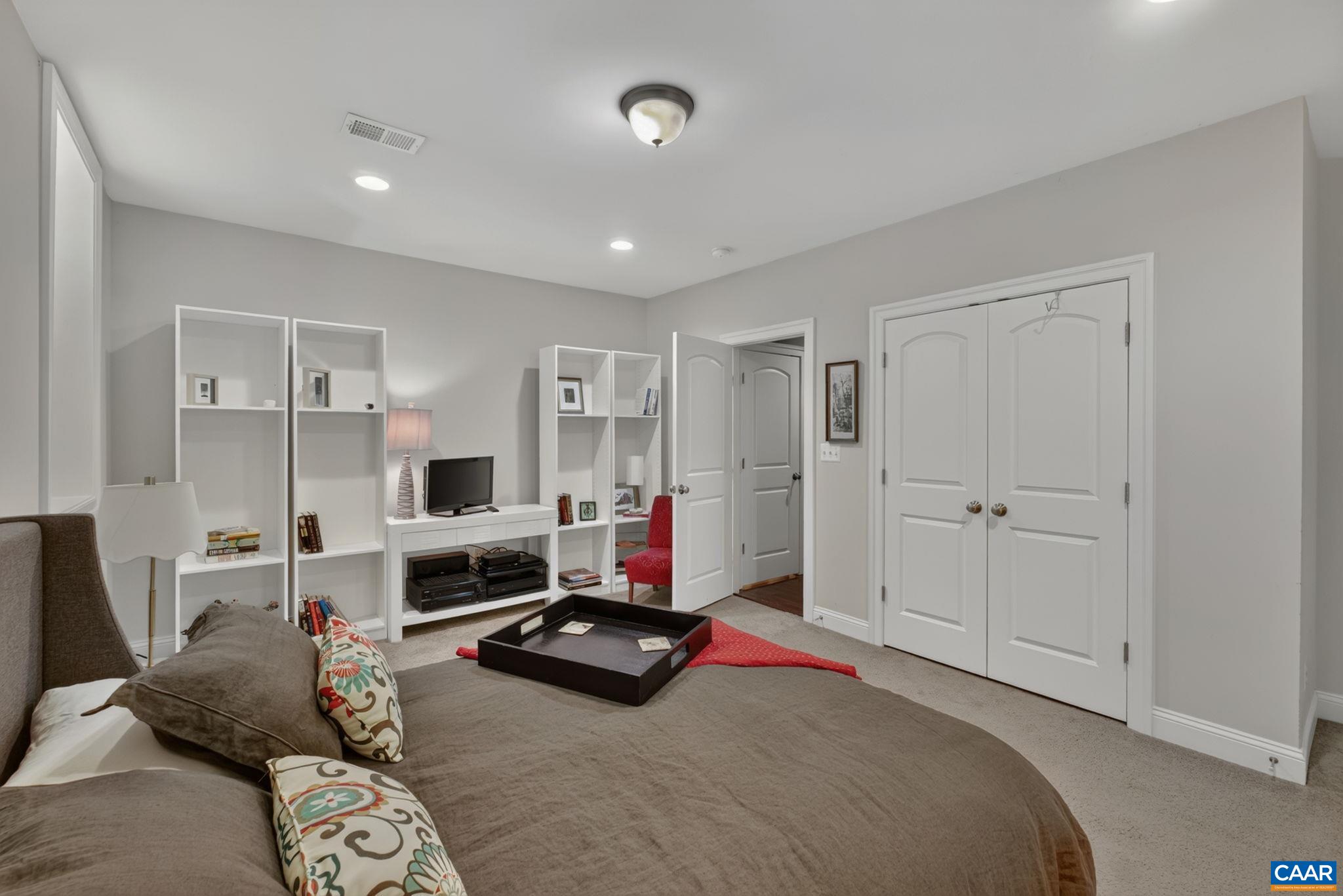 Lower level en suite bedroom with built-ins. Lower level en suite bedroom with built-ins.