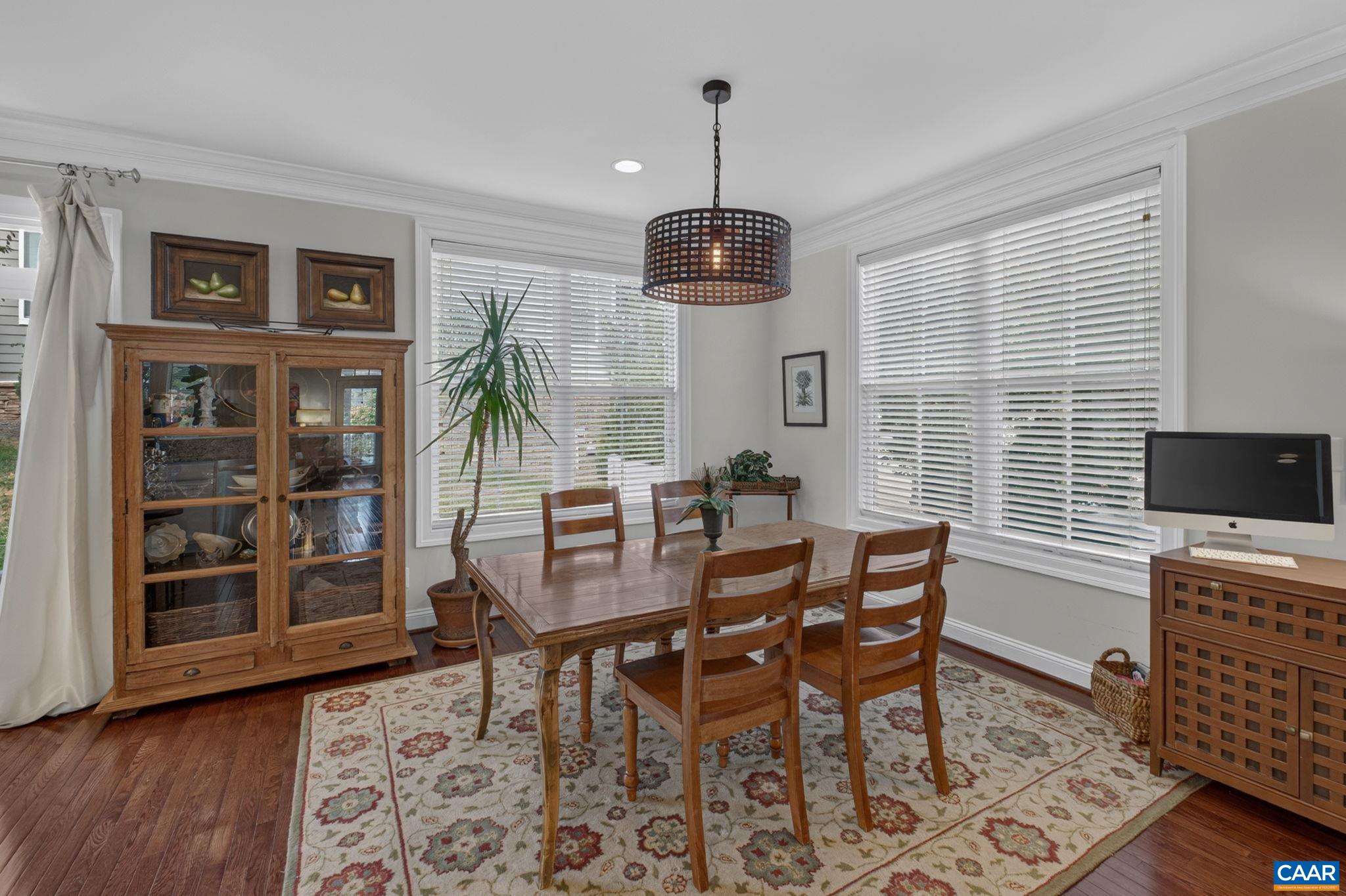 Main level dining area. End unit affords more light with side windows. Main level dining area. End unit affords more light with side windows.