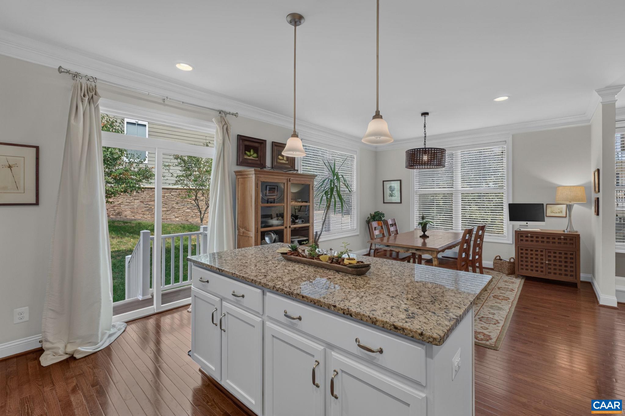 Kitchen island and dining area. Kitchen island and dining area.